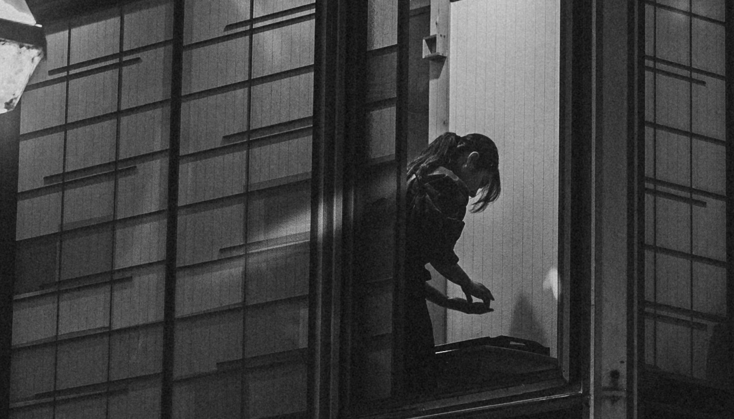 Lady preparing a meal by the window.jpg