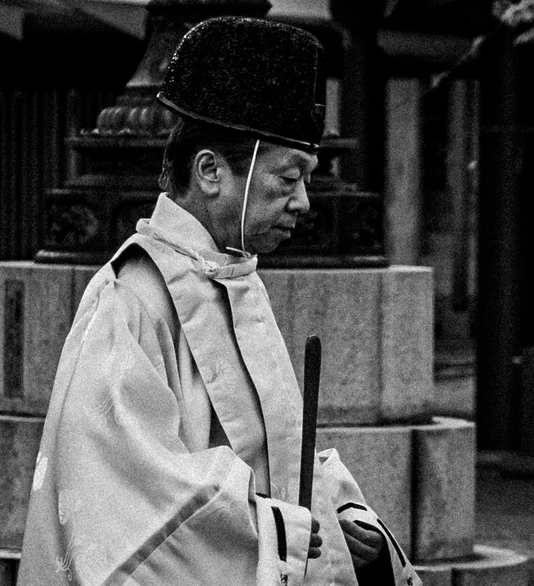 Monk walking in temple grounds.jpg