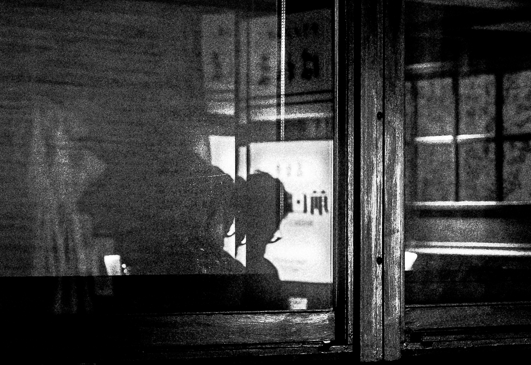 Man on other side of window.png