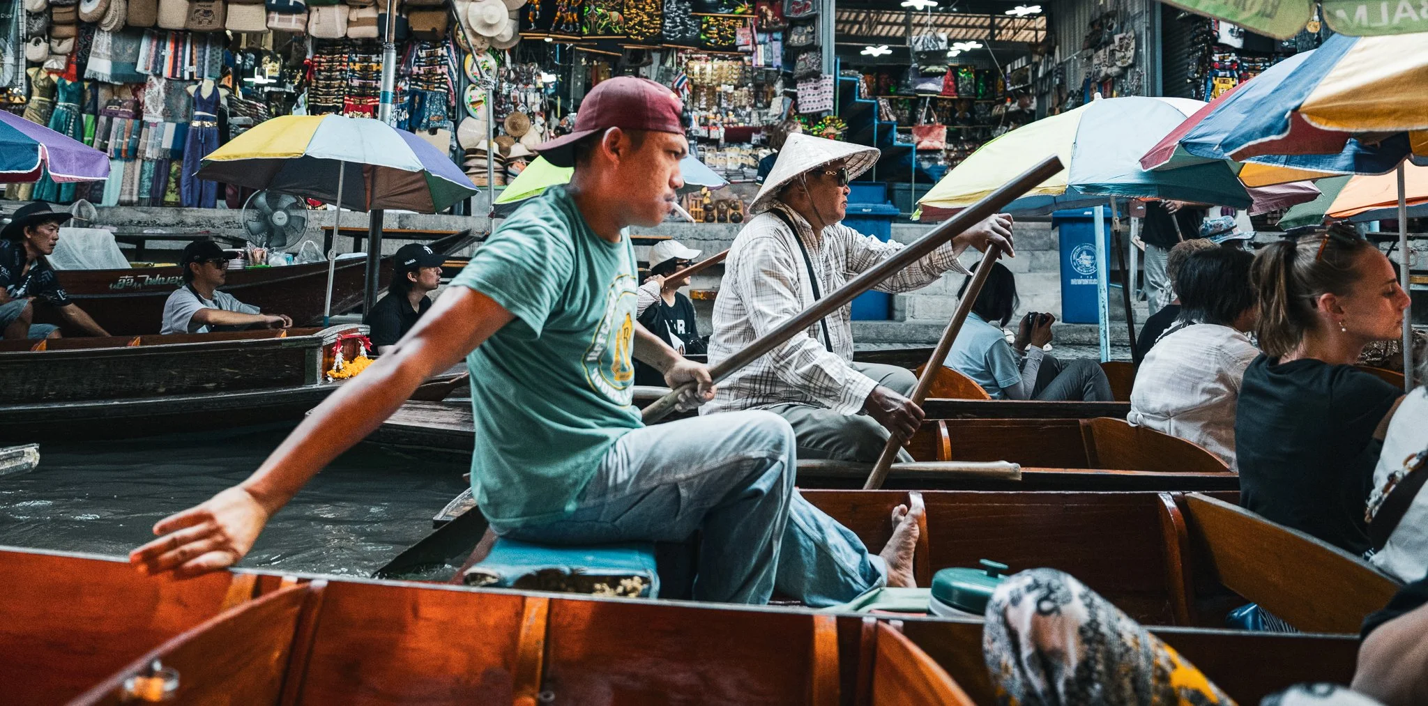 Floating market smoking man pushing by.jpg