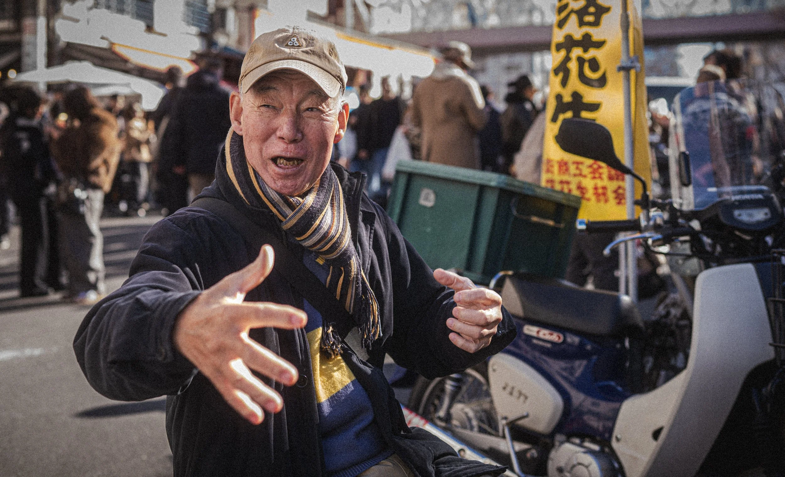 Man at fish market sitting by motorcycle.jpg