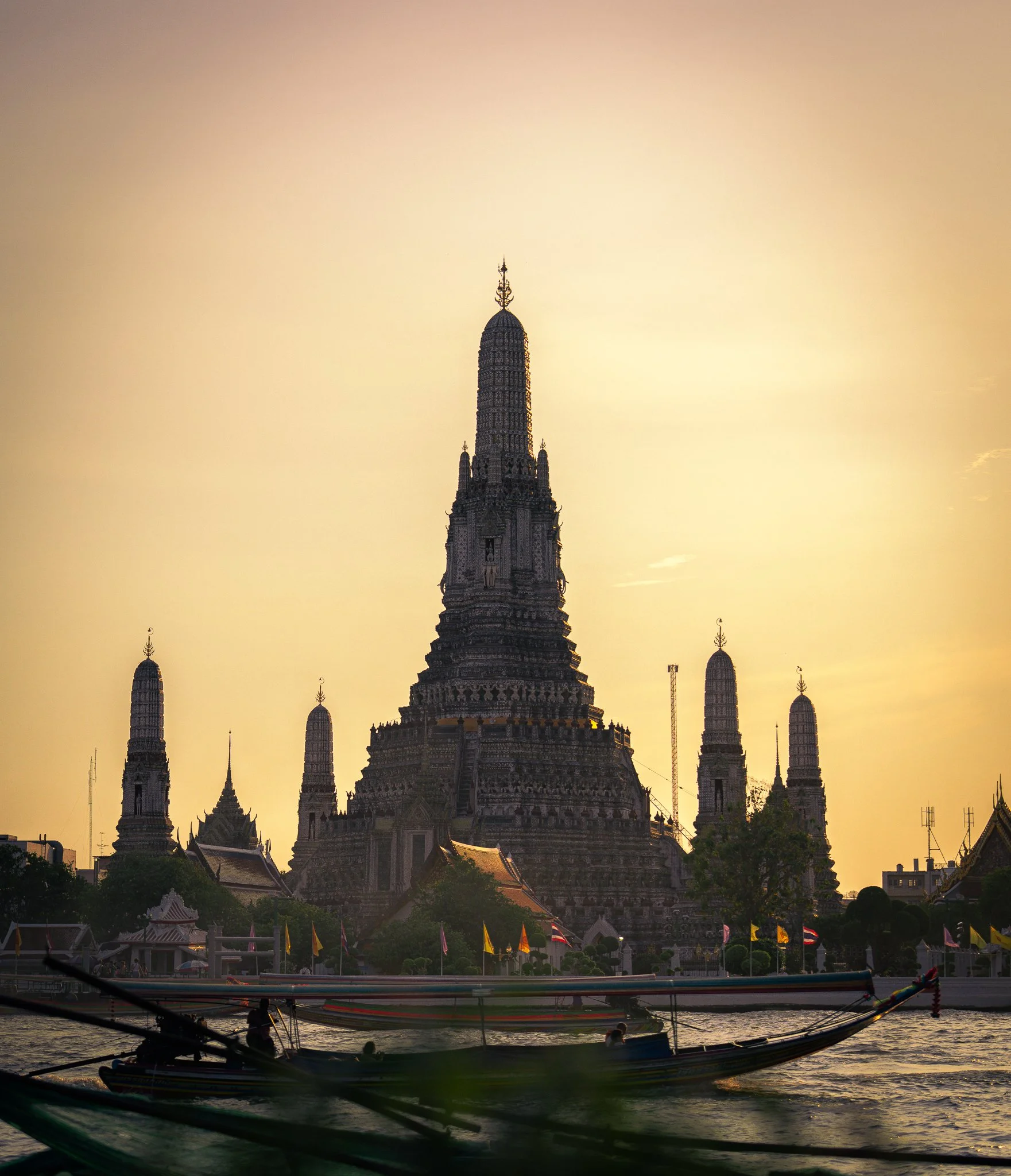 Wat Arun fishing boat crossing in foreground.jpg
