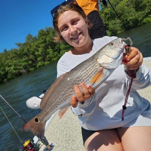 emily with red drum .jpeg