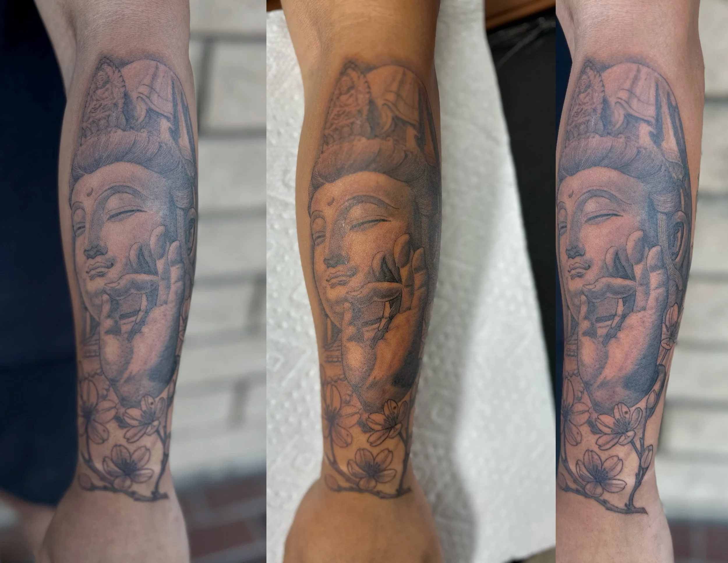 Tattooed forearms with floral and abstract designs.
