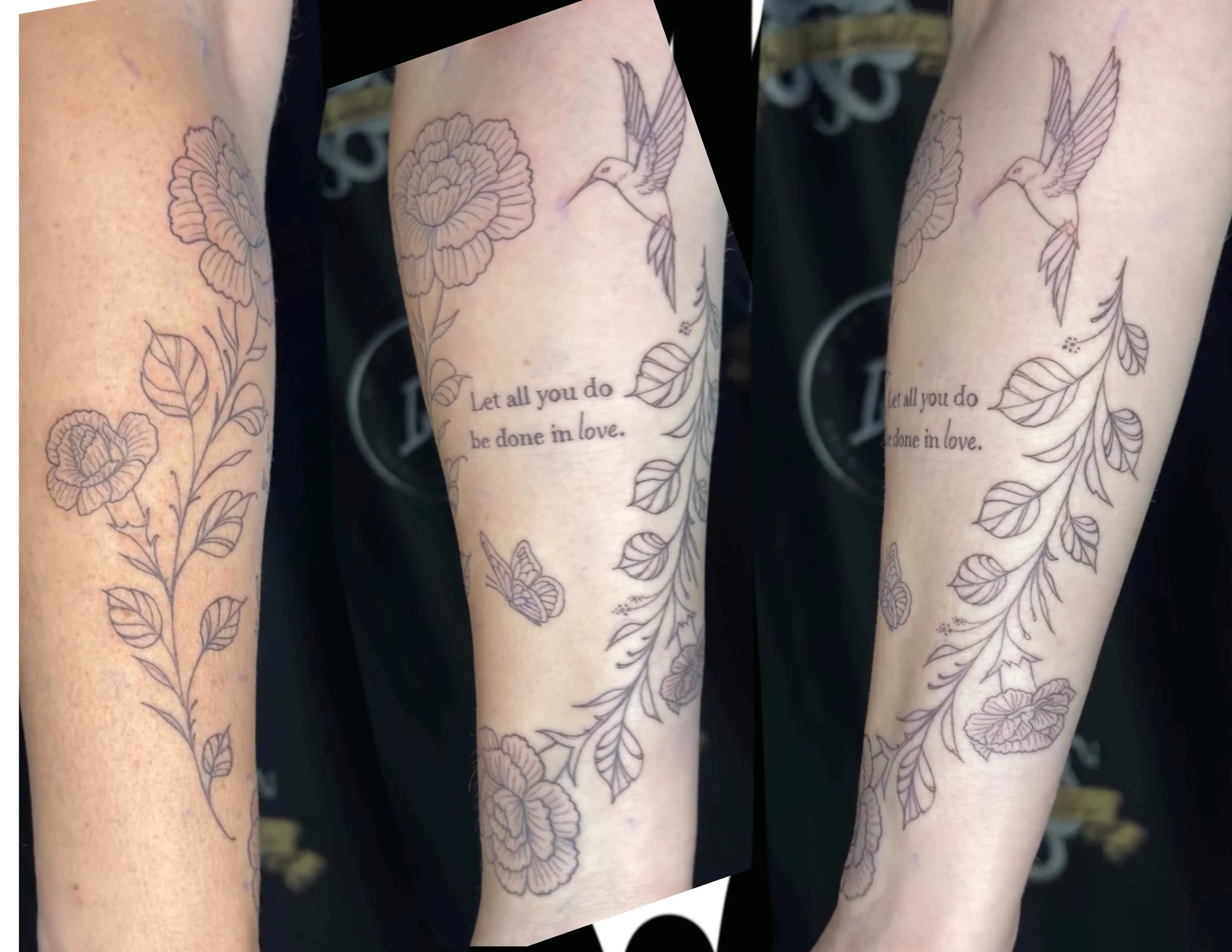 Close-up of tattooed arm with floral and hummingbird designs, including a quote that reads 'Let all you do be done in love.'