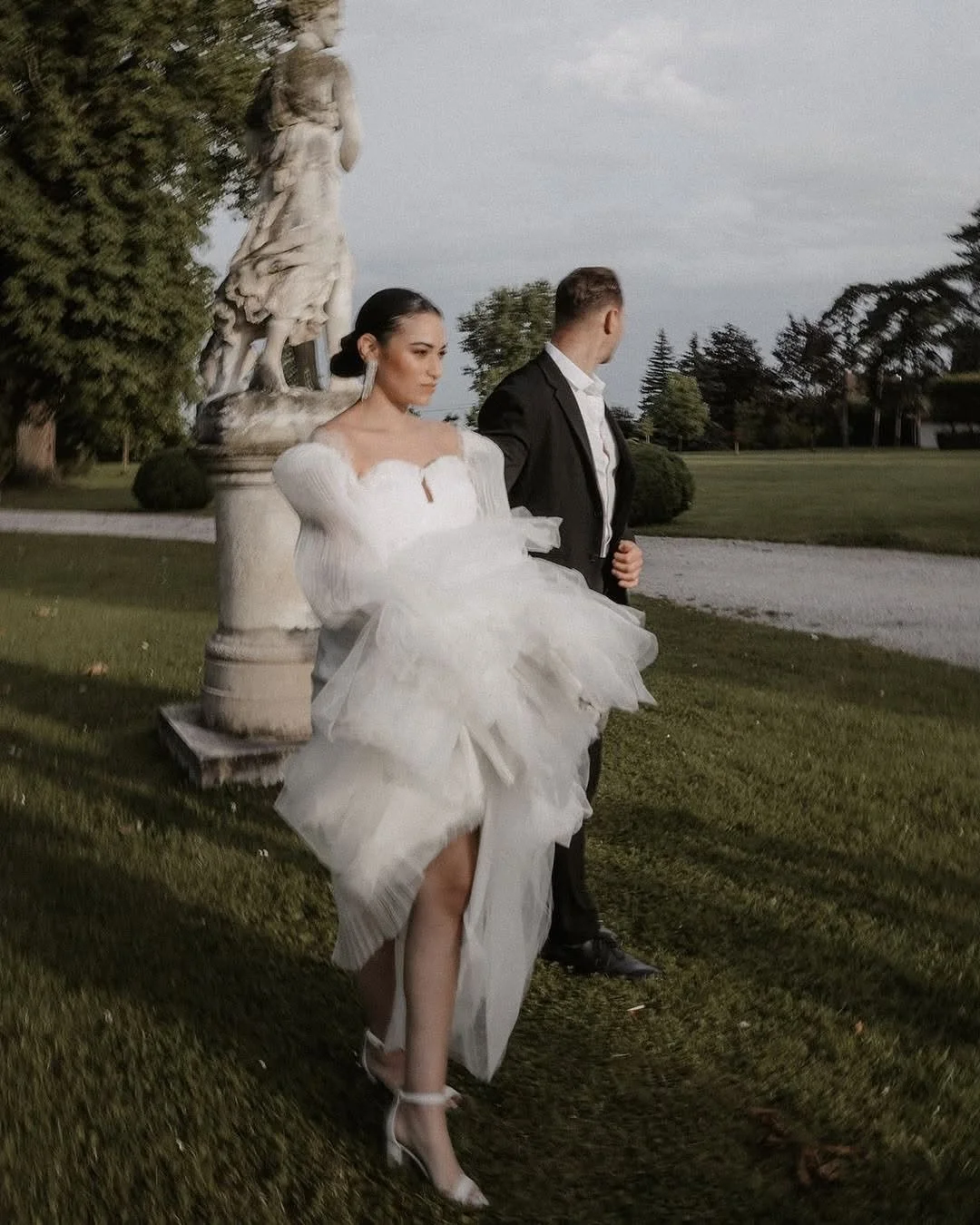 The Kaily gown by Lana Marinenko is a bold statement of modern bridal fashion.

Its architectural design, featuring dramatic voluminous sleeves and a structured corset bodice, highlights the bride&rsquo;s elegance and confidence. The lightweight fabr