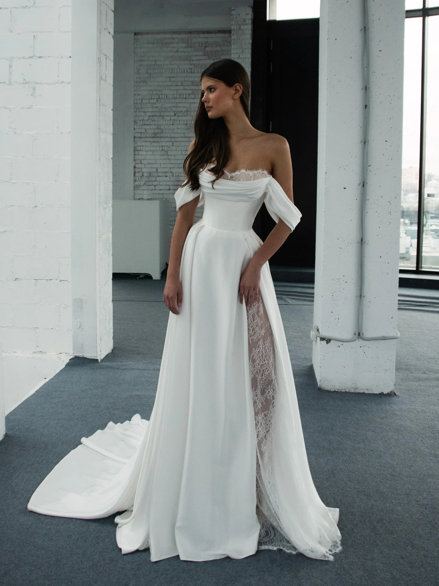 The Flanrie Gown: Contemporary Elegance with a Touch of Allure 

The Flanrie gown redefines modern romance with its flawless balance of sophistication and sensuality. Designed for the confident bride who values both grace and individuality, this gown