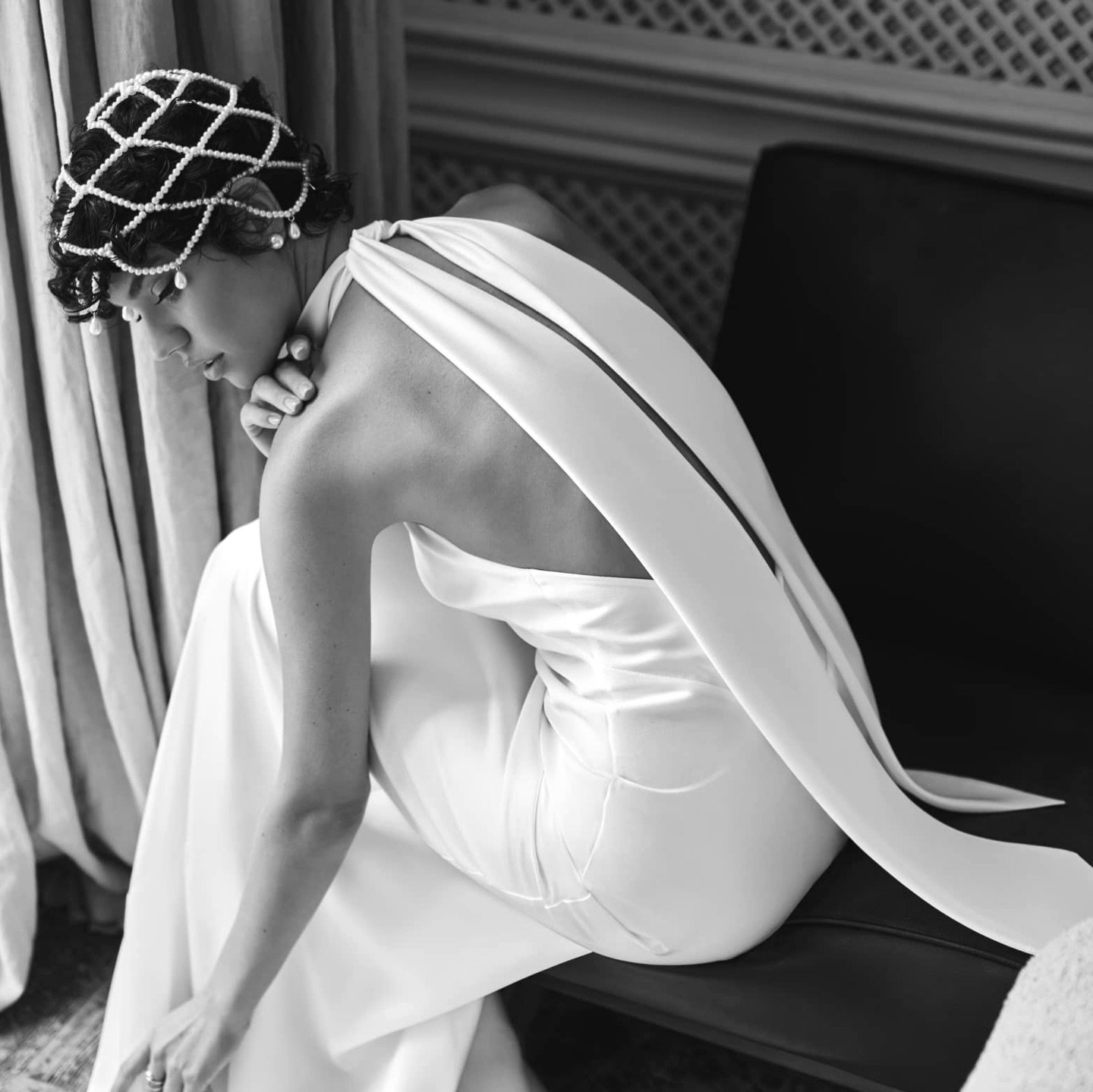 The Ronda gown is all about timeless elegance with a modern twist. Featuring a sleek halter neckline and an open back with a flowing tie detail, it&rsquo;s the perfect choice for brides who love minimalist style but still want to make a statement. Ef