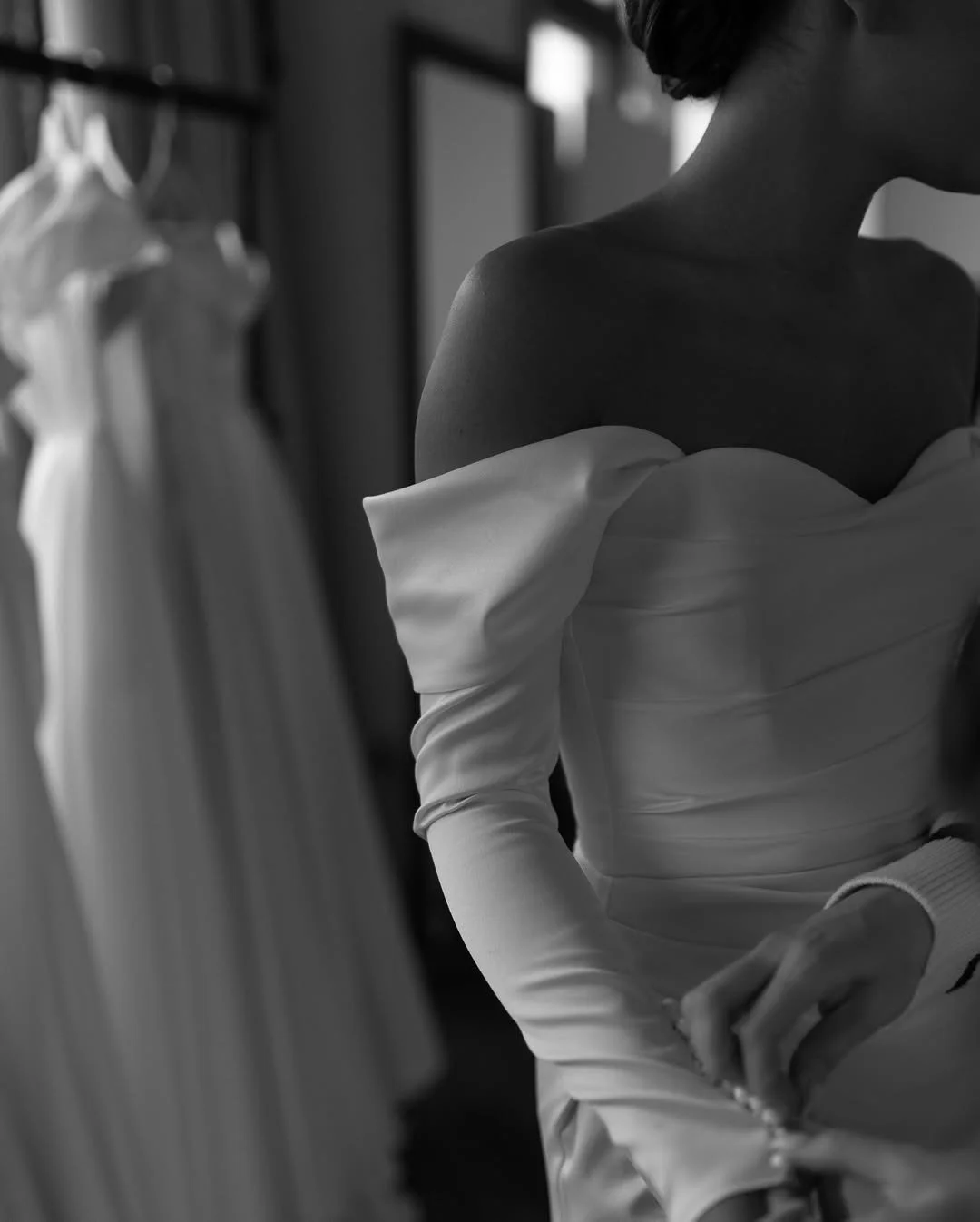 Effortlessly timeless, undeniably modern. 🤍This gown is all about quiet confidence &mdash; sleek lines, off-the-shoulder romance, and that unforgettable silhouette.Designed for the bride who wants to keep it classic, but make it hers.Understated? Ye