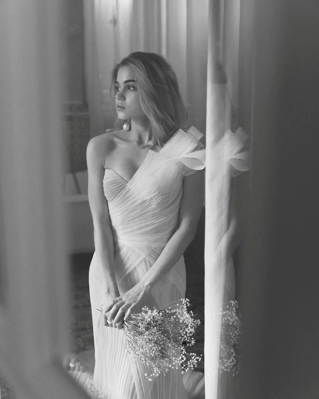 The Jacqueline Gown: Bold Elegance for the Modern Bride

Make a statement on your wedding day with the Jacqueline Gown, an elegant yet edgy wedding dress designed for the confident bride. Featuring a luxurious pleated tulle fabric, this gown offers t