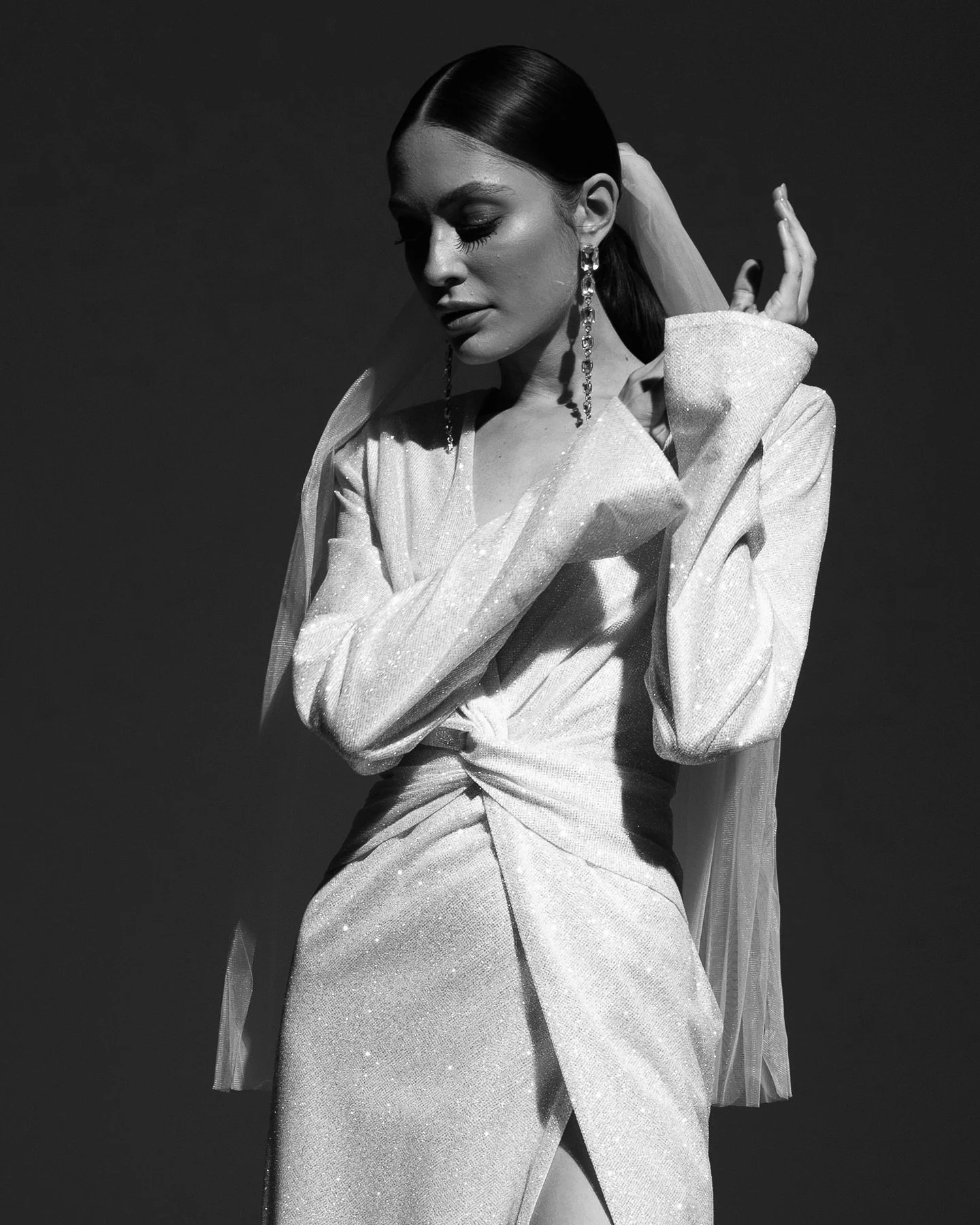 The Mazunte Wedding Gown: Chic, Shimmering Elegance.
Turn up the glamour with The Mazunte, a dazzling reception wedding dress designed for the bride who&rsquo;s ready to shine. With its shimmering fabric, statement shoulders, and sultry silhouette, t