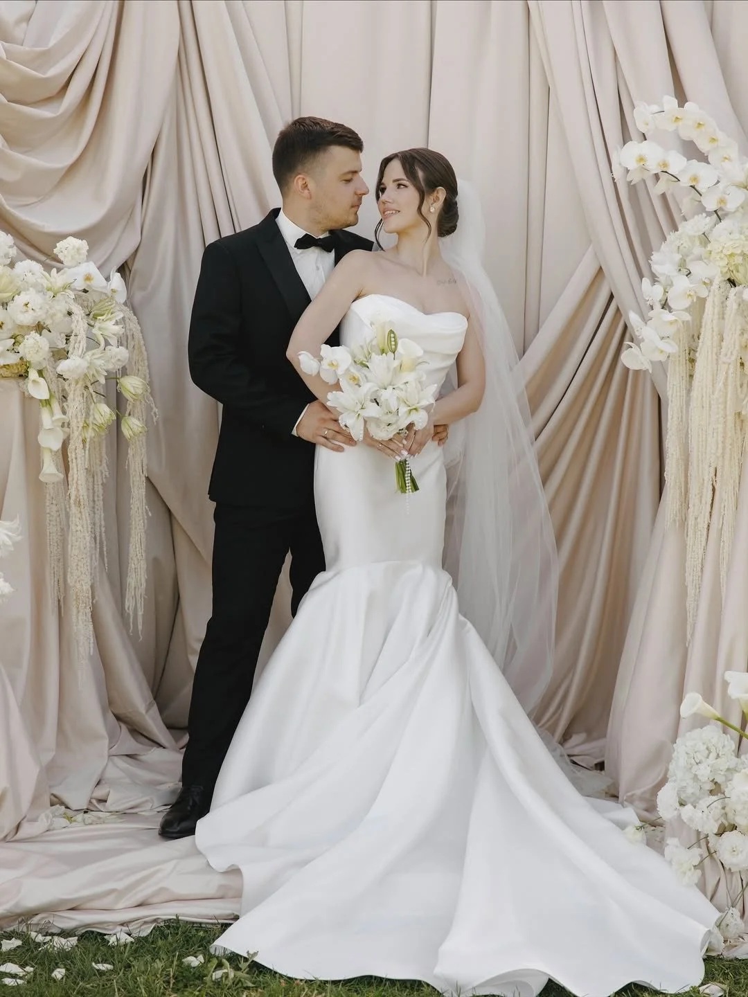 Meet Dorsey &mdash; our brand-new wedding gown that redefines modern elegance.

This strapless beauty features a structured bodice with delicate detailing along the neckline and a daring high slit that adds both drama and sophistication. The flowing 