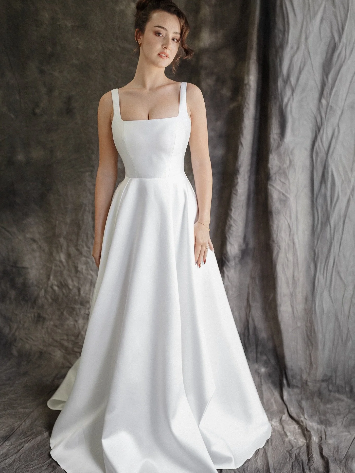 The Aliana Gown: Modern Simplicity with a Bold Edge

The Aliana gown captures the essence of contemporary bridal style &mdash; clean, structured, and effortlessly striking. Designed for the modern bride who values minimalism with a statement twist, t