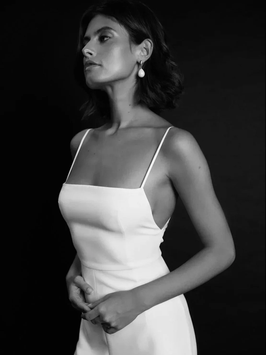 The Tequila Wedding Gown: Modern Simplicity with Effortless Glamour

Step into sleek sophistication with the Tequila gown, a minimalist yet striking wedding dress designed for the modern bride. With its clean lines, figure-hugging silhouette, and dar