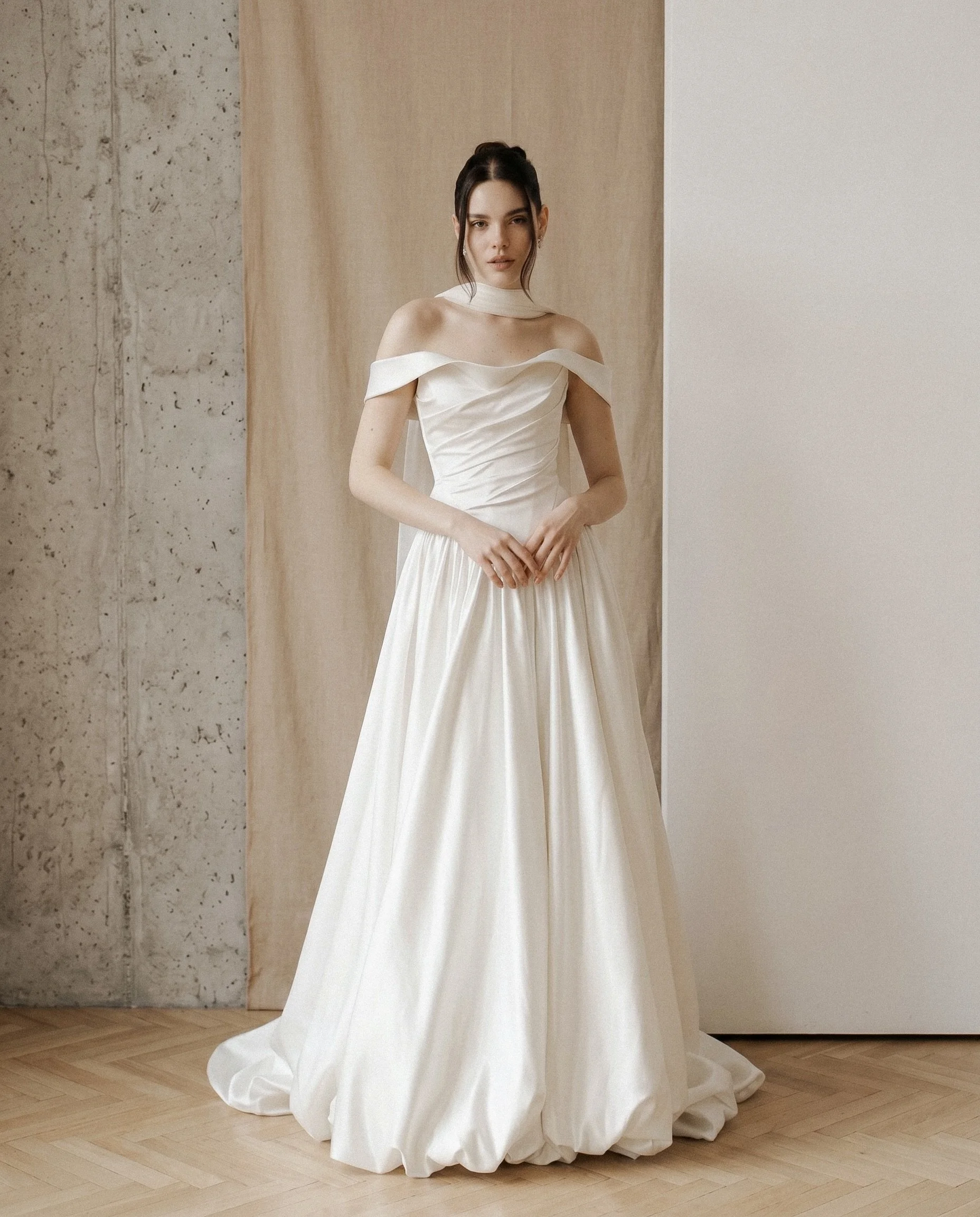 Romantic, sophisticated, and effortlessly modern, the Annecy Wedding Gown is designed for brides who love timeless elegance with contemporary versatility. This stunning two-piece wedding dress features a beautifully structured satin corset paired wit