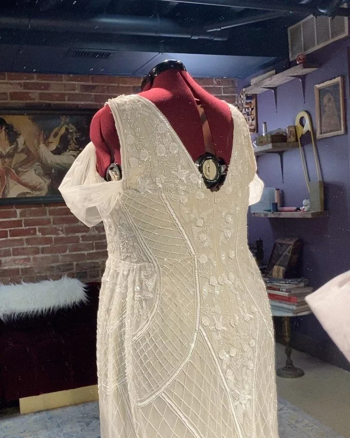 Complete transformation of a wedding dress• Swipe left to see the before and after• This amazing bride came to me with two of the same dresses• One for our base and the other to create a fuller skirt• Custom top and sleeves•