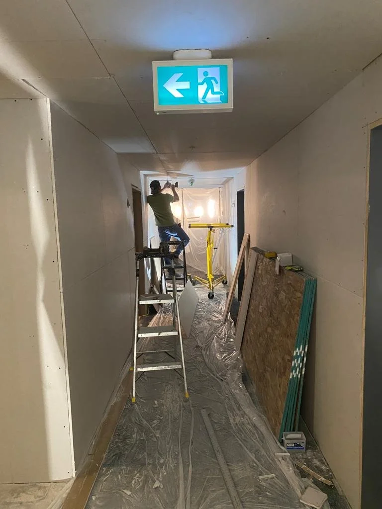 U7 HALLWAY DRYWALLED.jpg