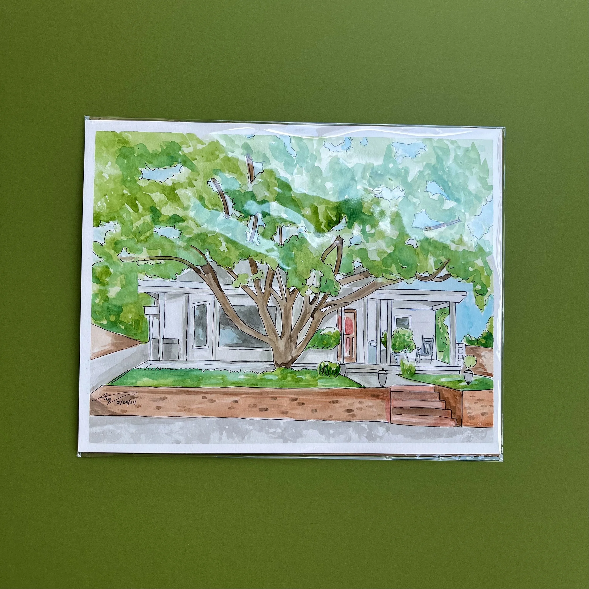 Watercolor painting of a house with a large tree in front, green grass, brick steps, and a porch with chairs.