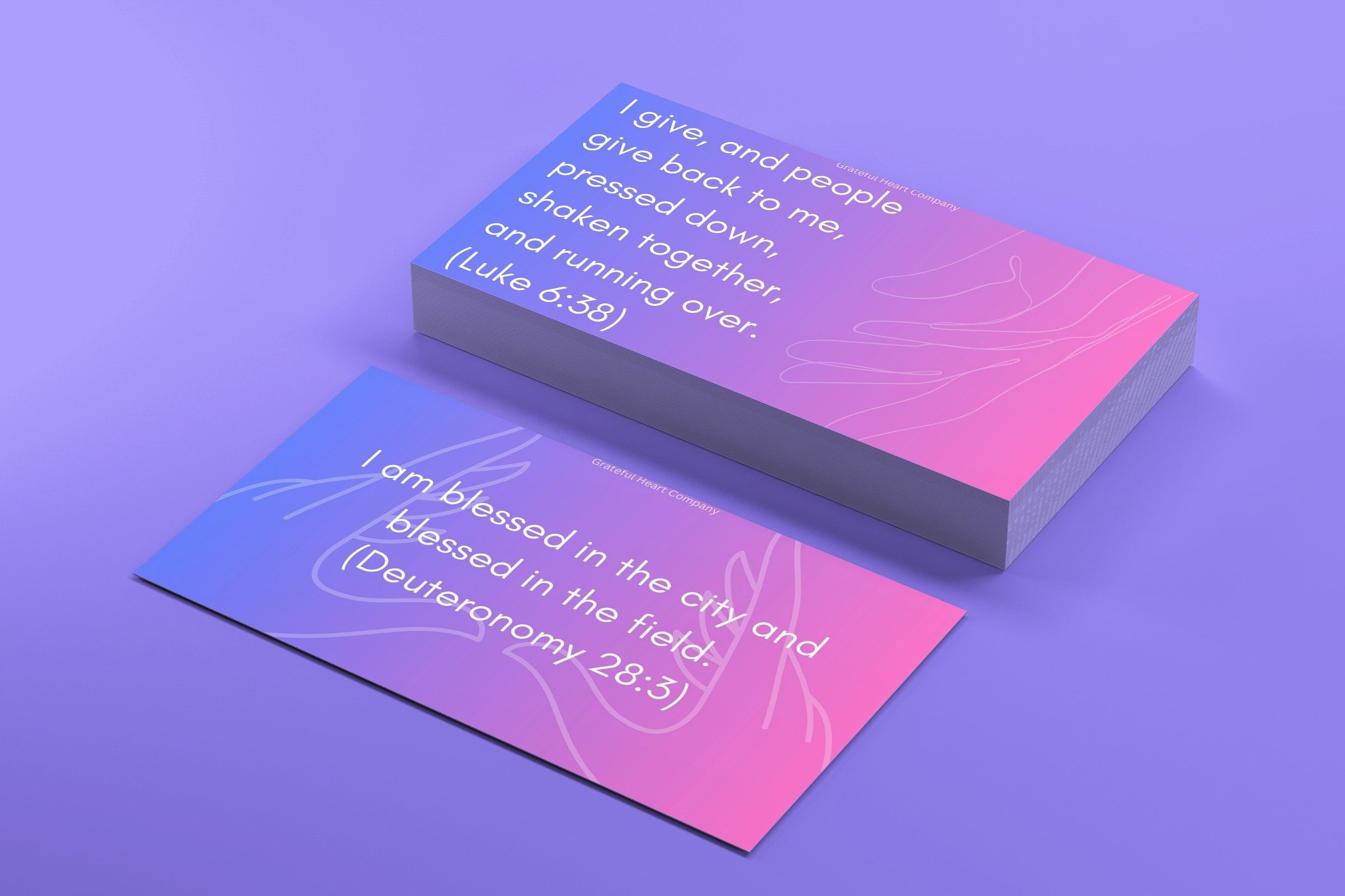 two stacks of affirmation cards on a purple background