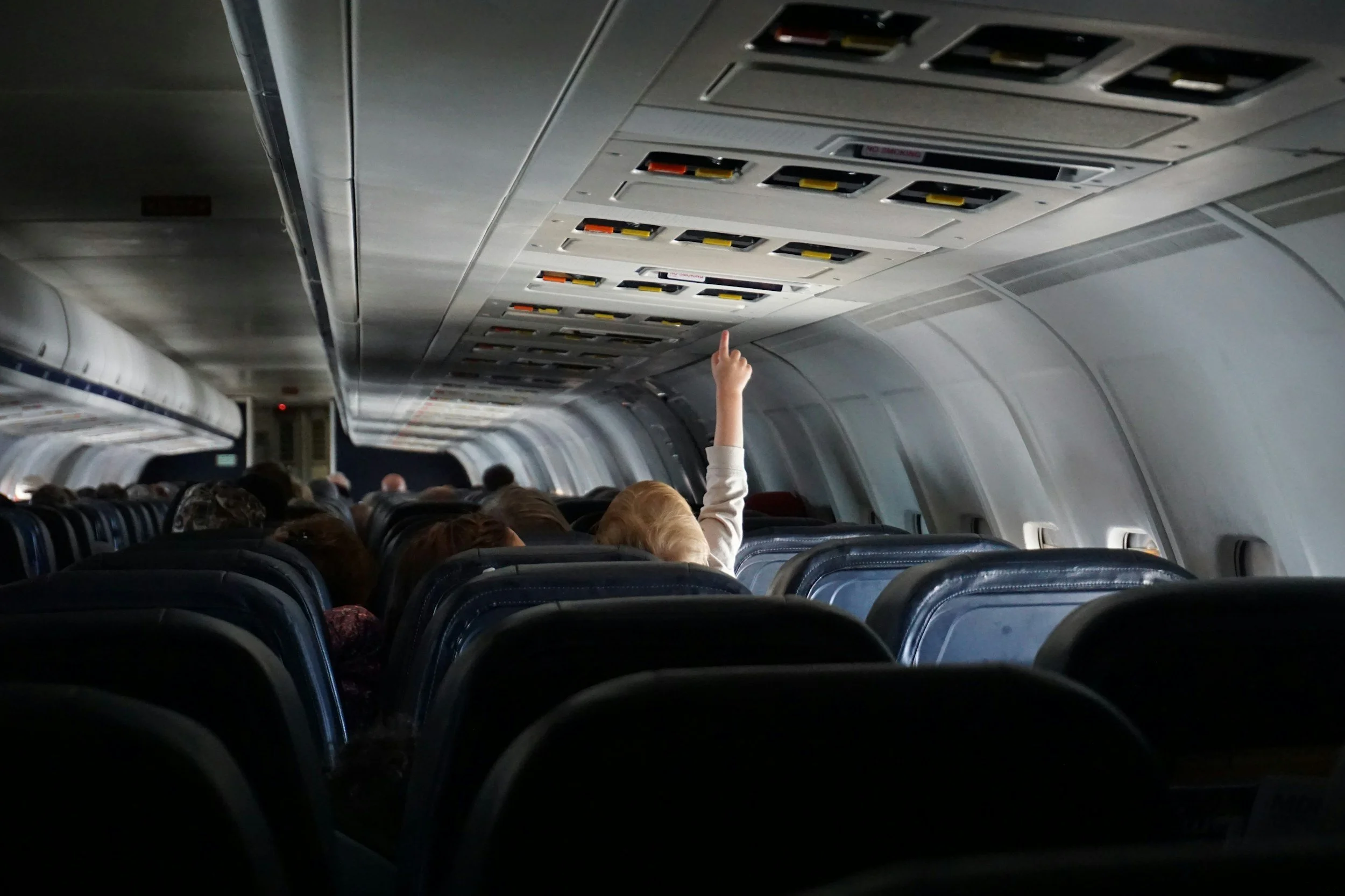 Baby on a plane featured in an article called 'Can You Bring Baby Food on a Plane in Kansas City?'
