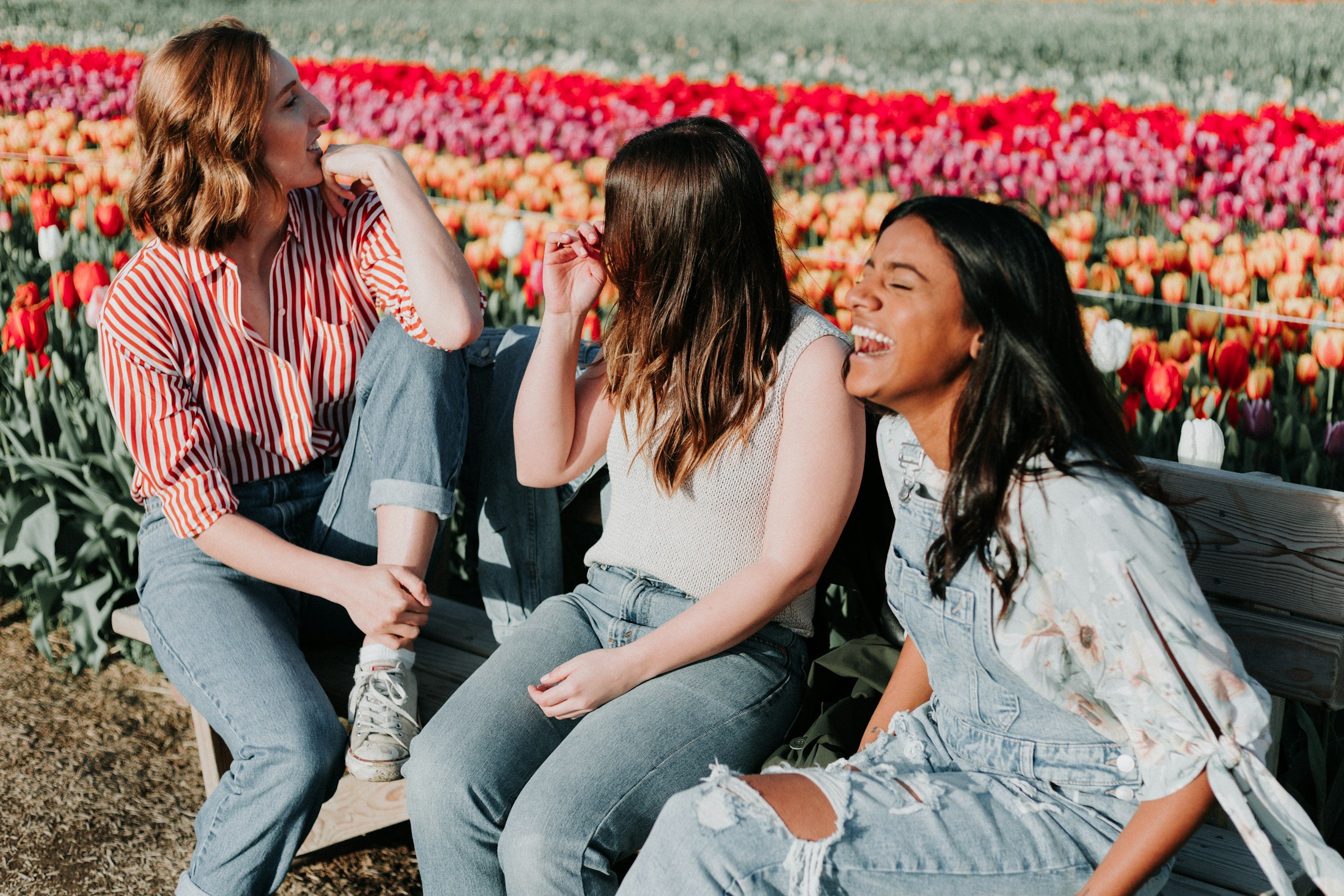 3 female presenting friends hanging out and showing support as their friend goes through TVF treatments.