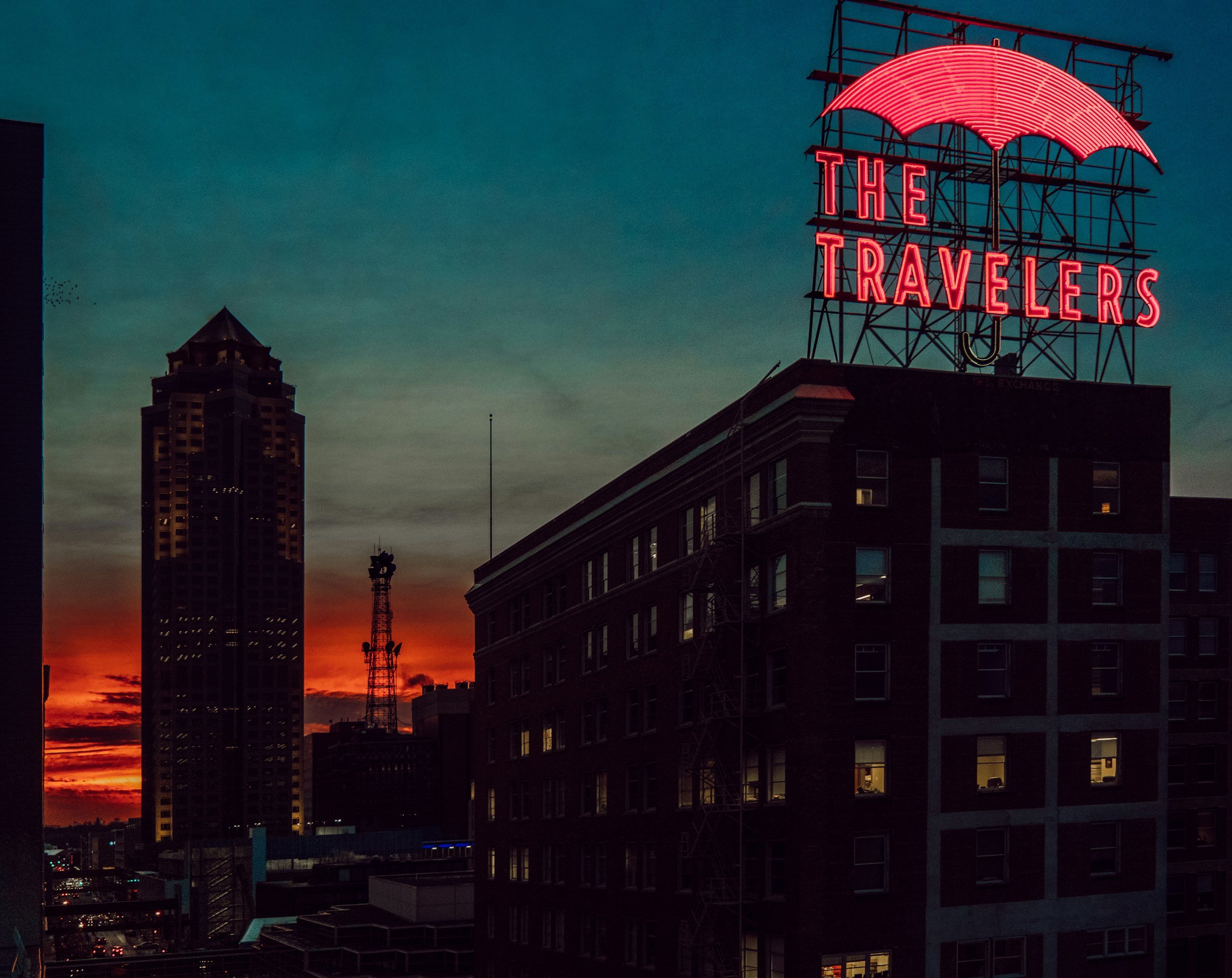 The Travelers sign in Des Moines, IA featured in the 'where to go for fun around Kansas City' section of a blog about the best places to travel with a baby in Kansas City blog.