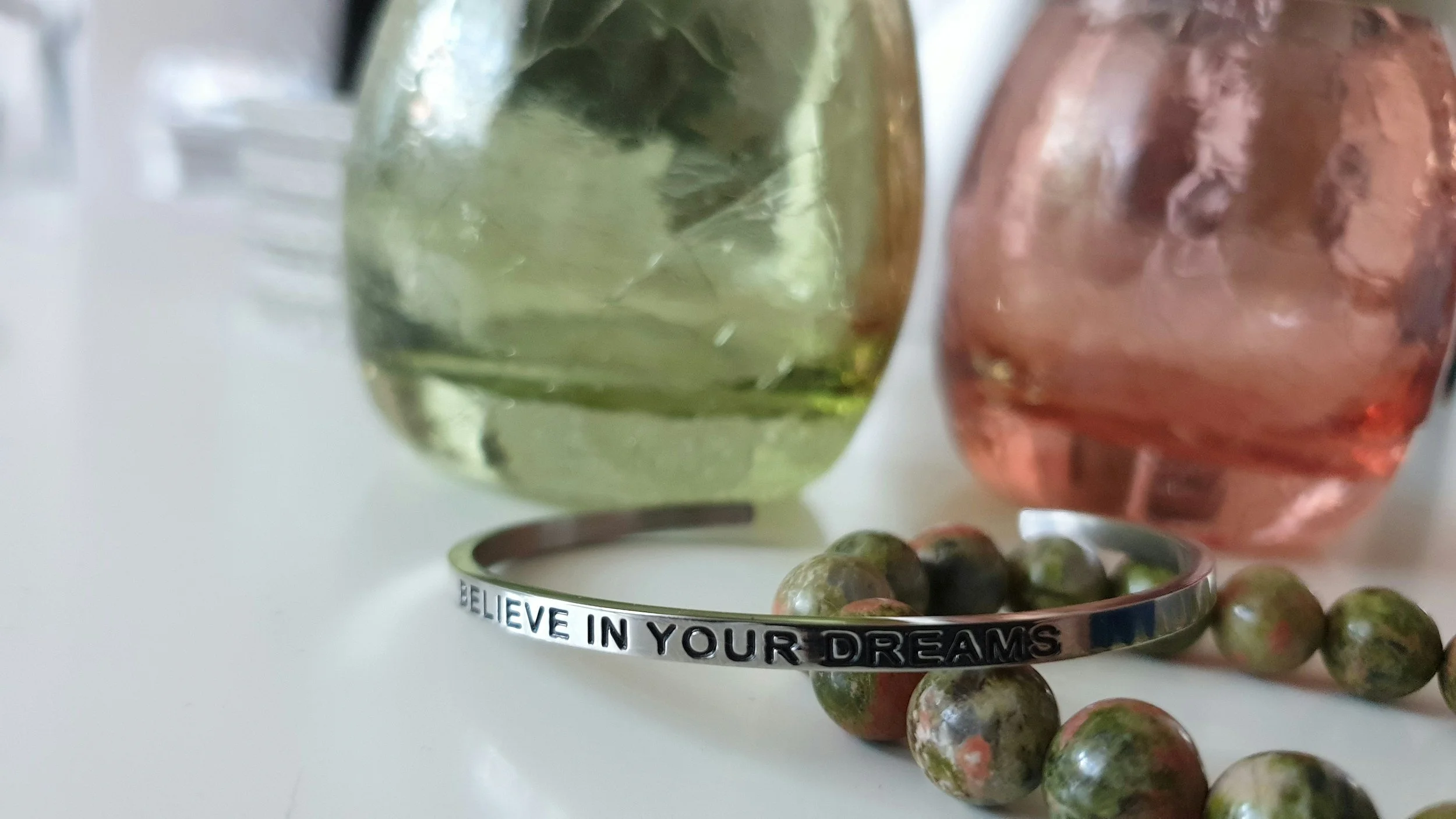 A bracelet that reads Believe In Your Dreams featured on a list of graduation gifts for her in Kansas City
