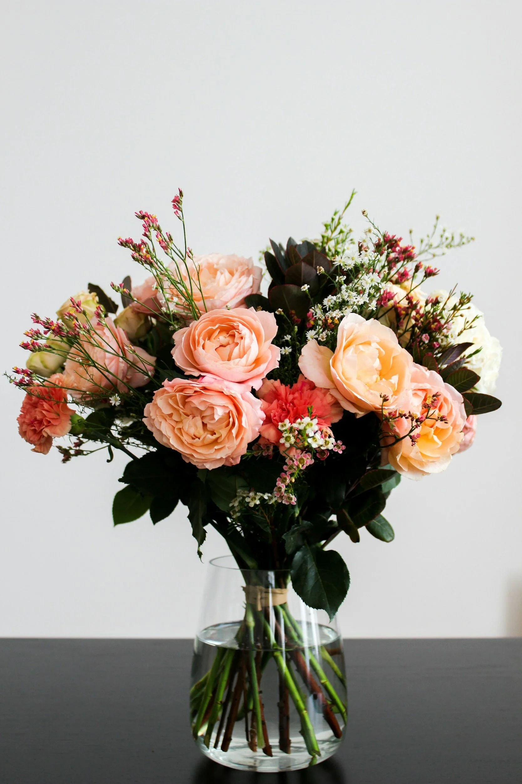Boquet of flowers in a vase featured in a bout about the 3 most common Mother's Day gifts by Grateful Heart Company.