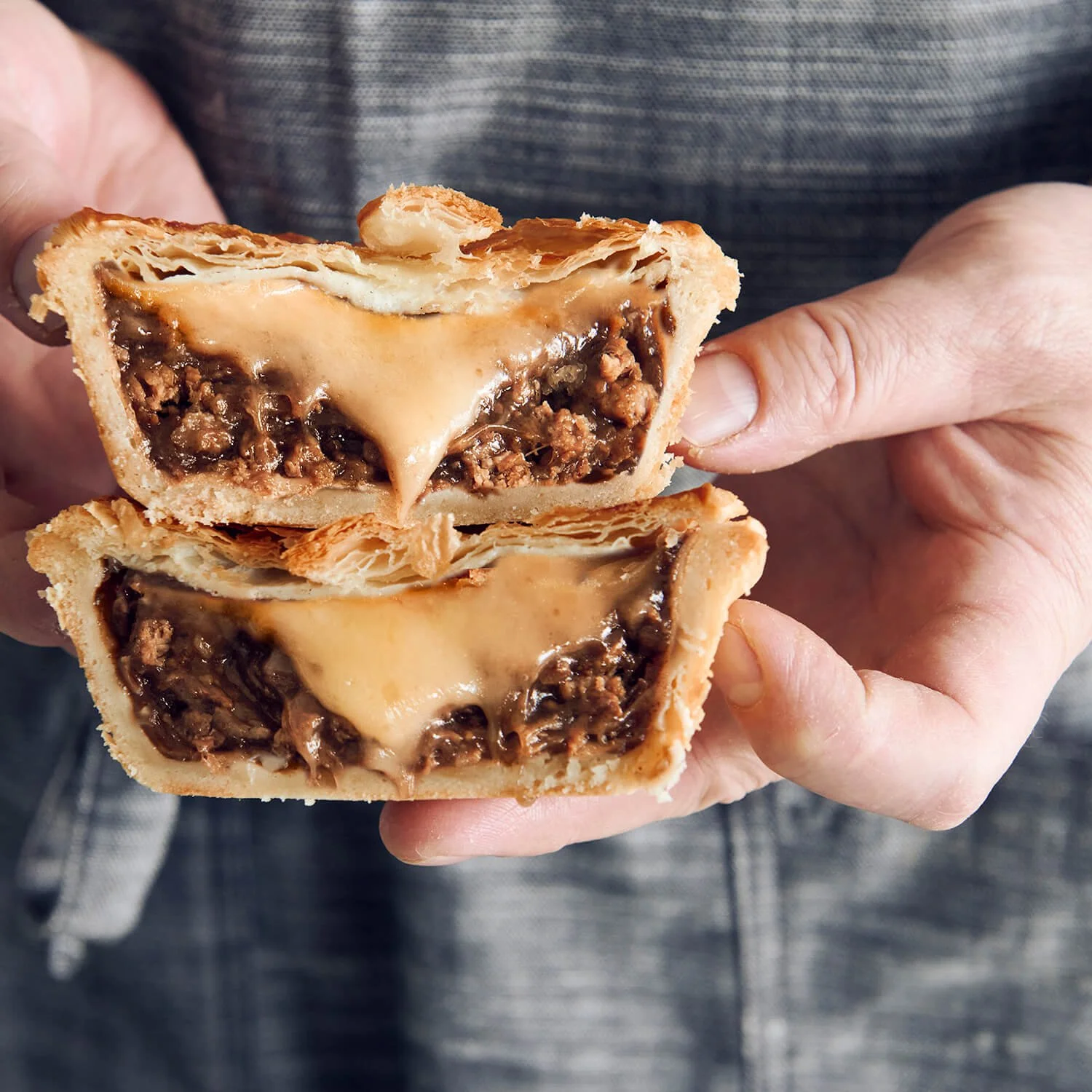 Steak Cheese Pie  with flaky puff pastry top, crusty base , and juicy meat filling.