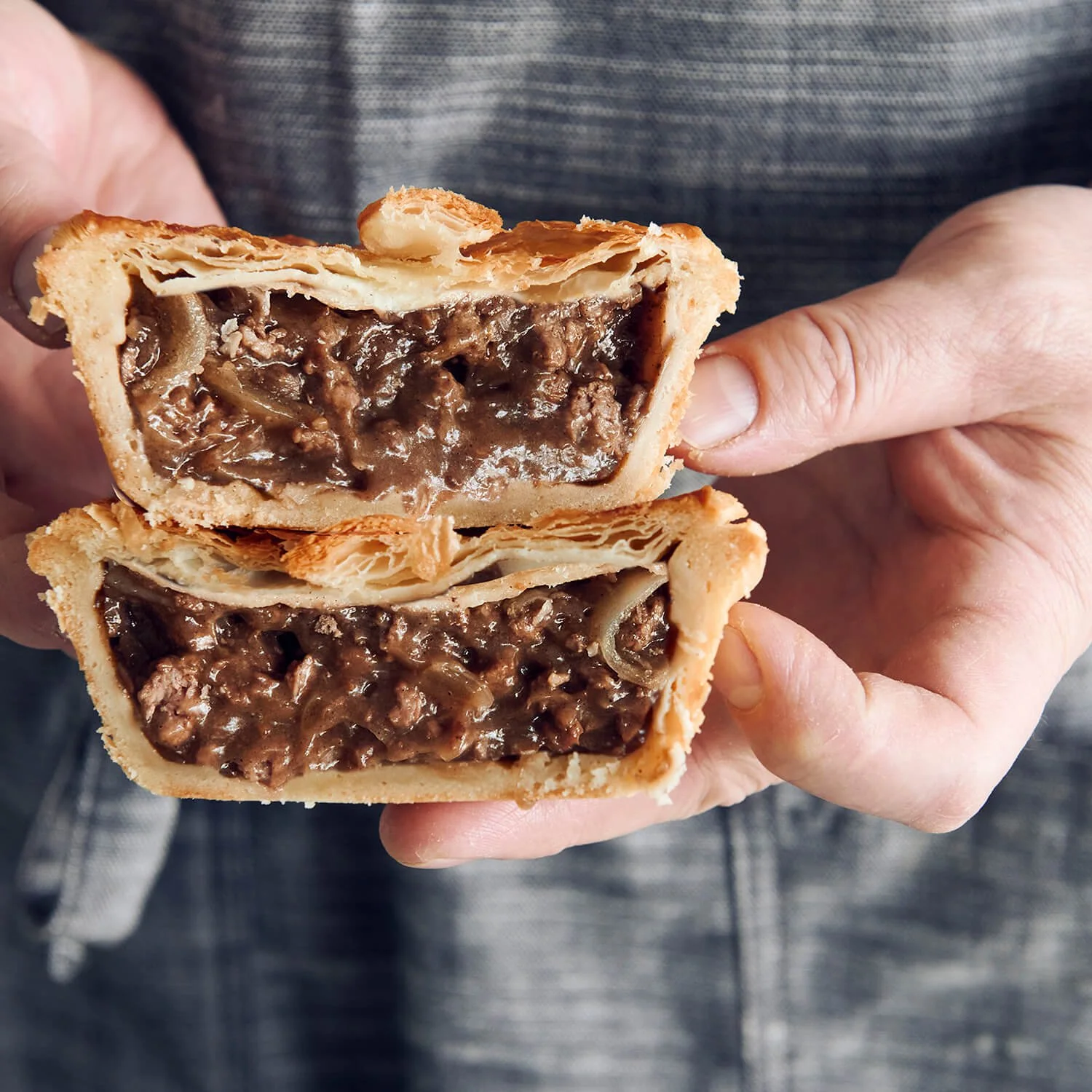 Steak Onion Pie with flaky puff pastry top, crusty base , and juicy meat filling.