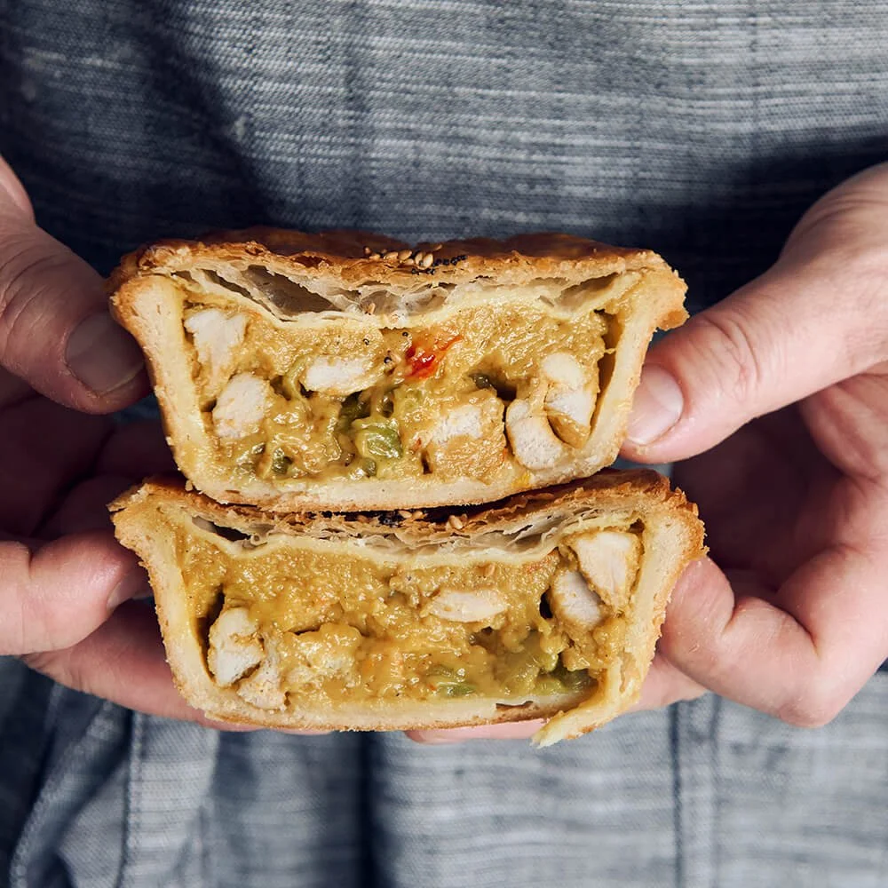 Thai Chicken Pie  with flaky puff pastry top, crusty base , and juicy meat filling.