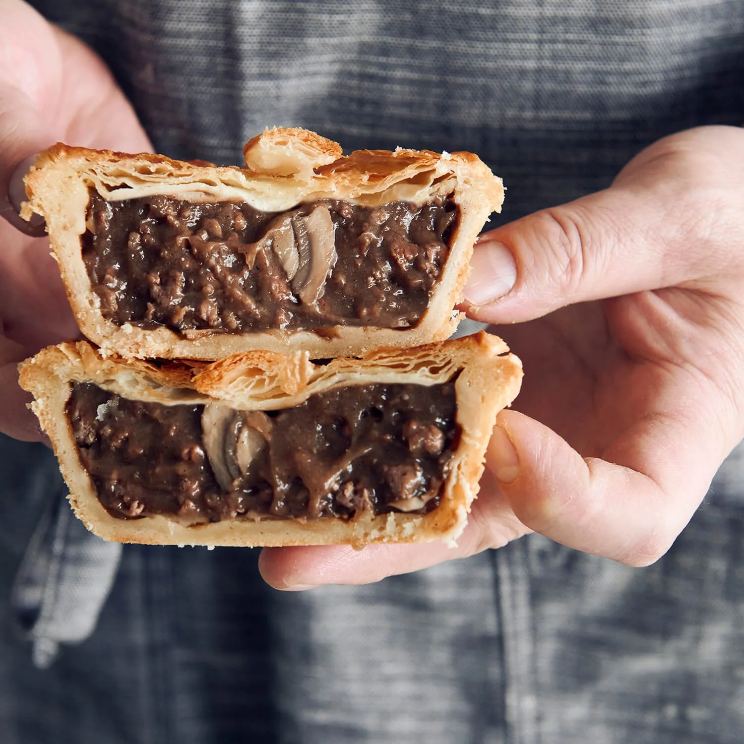 Steak Mushroom Pie  with flaky puff pastry top, crusty base , and juicy meat filling.