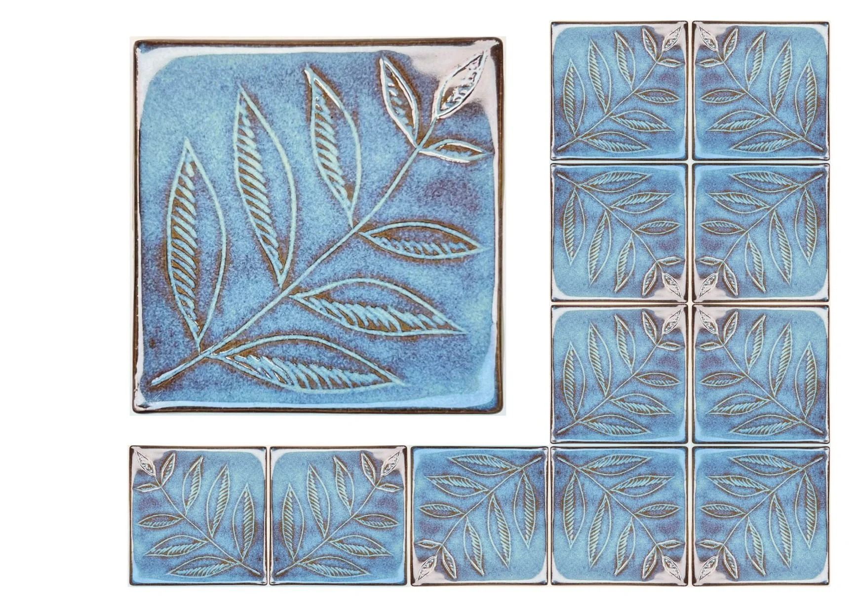 Set of ceramic tiles with a blue background and an embossed leaf pattern, arranged in a grid. One larger tile features a detailed leaf design with multiple smaller tiles displaying similar leaf motifs.