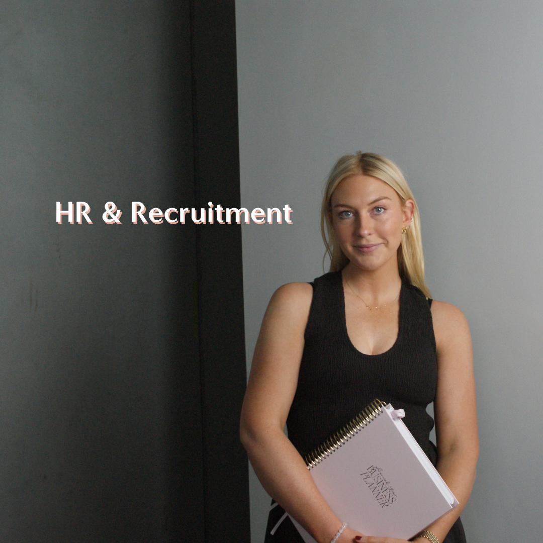 A young blonde woman holding a notebook titled 'Business Planner' stands in front of a two-tone gray wall with the text 'HR & Recruitment' overlaid on the image.