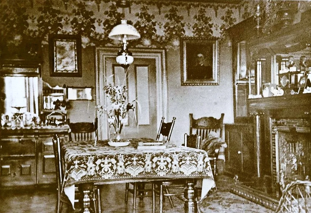 Dining room c. 1916. The ceiling lamp is gas and the portrait at right is of Ernest's mother Sarah.