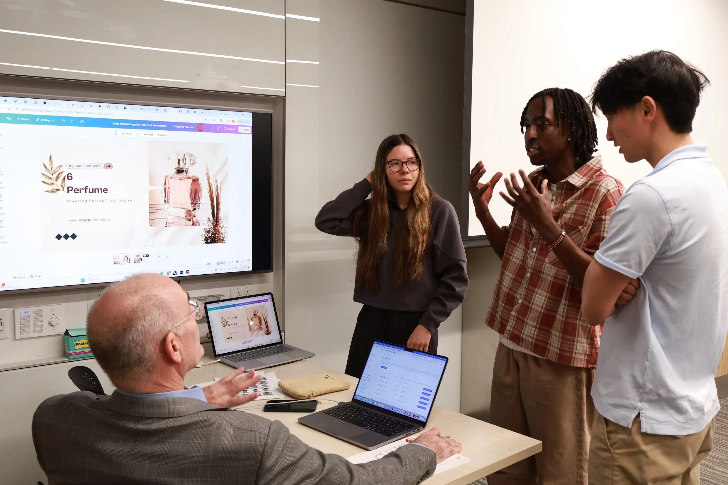 An instructor giving real-time feedback to a college student ptiching innovative business idea during a SimBus entrepreneurship simulation.