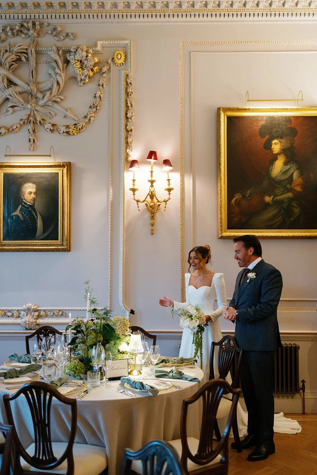 Bride and groom looking at wedding flowers by Bloom and Bridal at Hotham Hall Estate