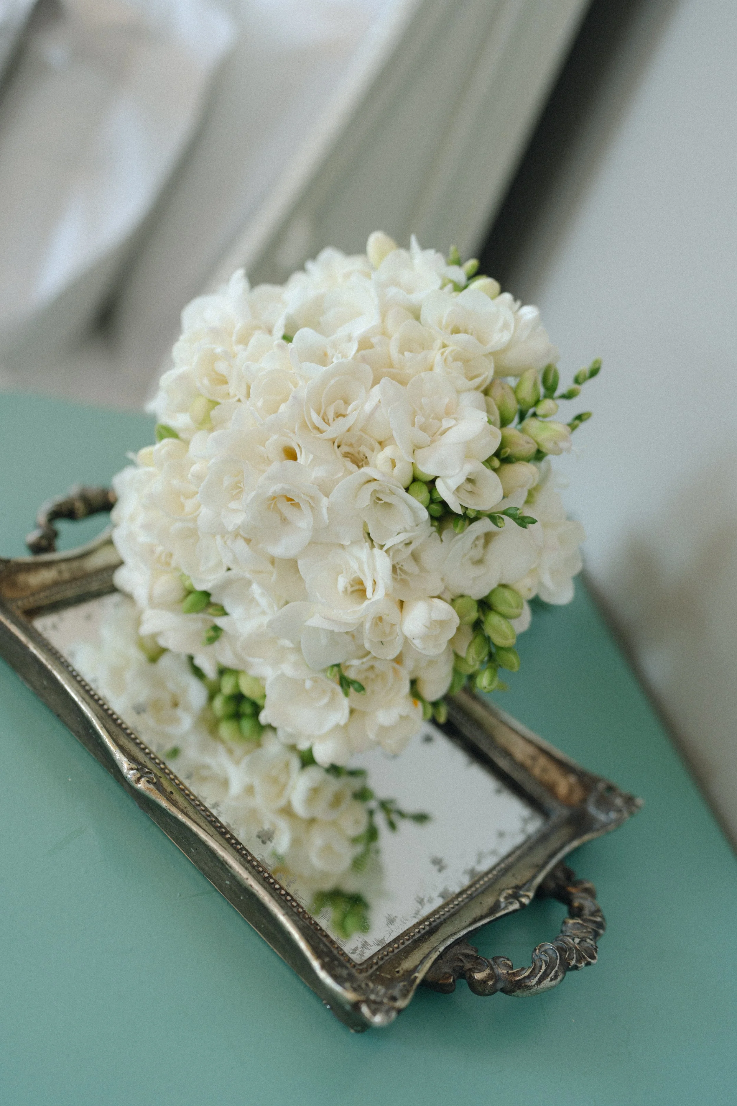 bridal bouquet of white freesias at thicket priory