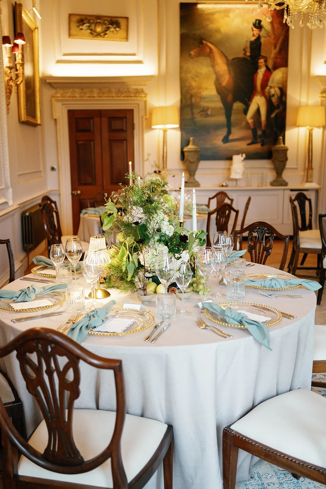 Tablecentre of hydrangeas ferns roses at Hotham Hall Estate