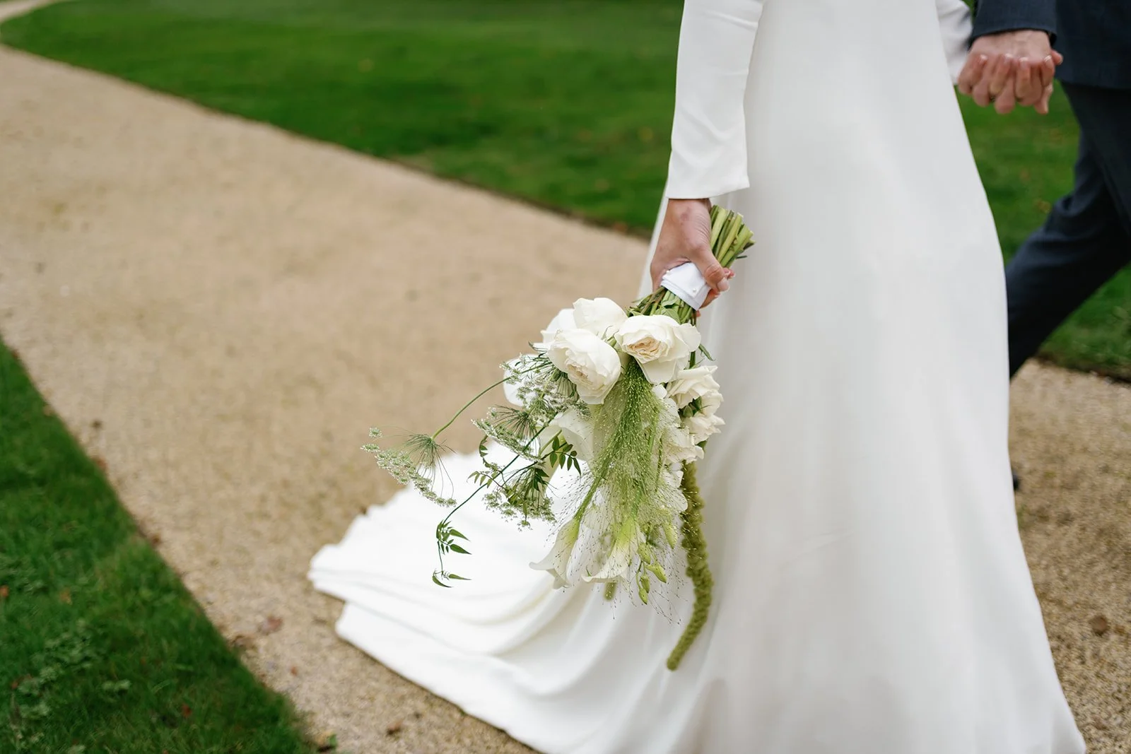 modern white and green bridal bouquet including callas orchids amaranthus at Hotham Hall Estate