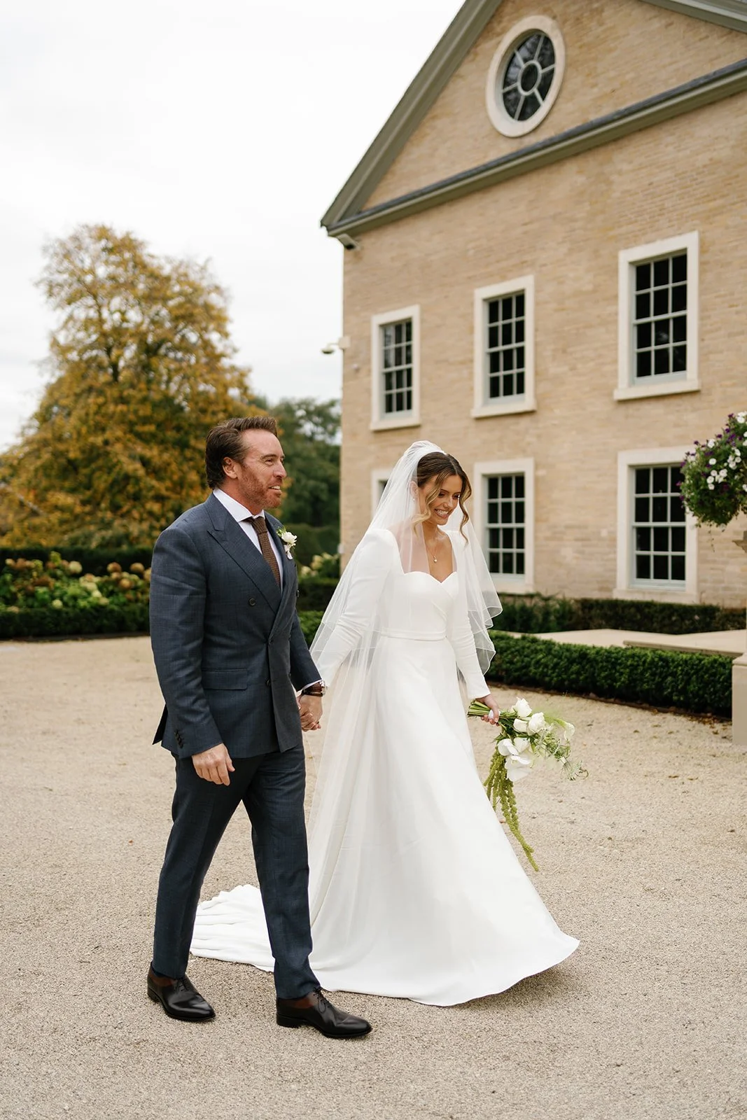 bride holding bridal bouquet at Hotham Hall Estate
