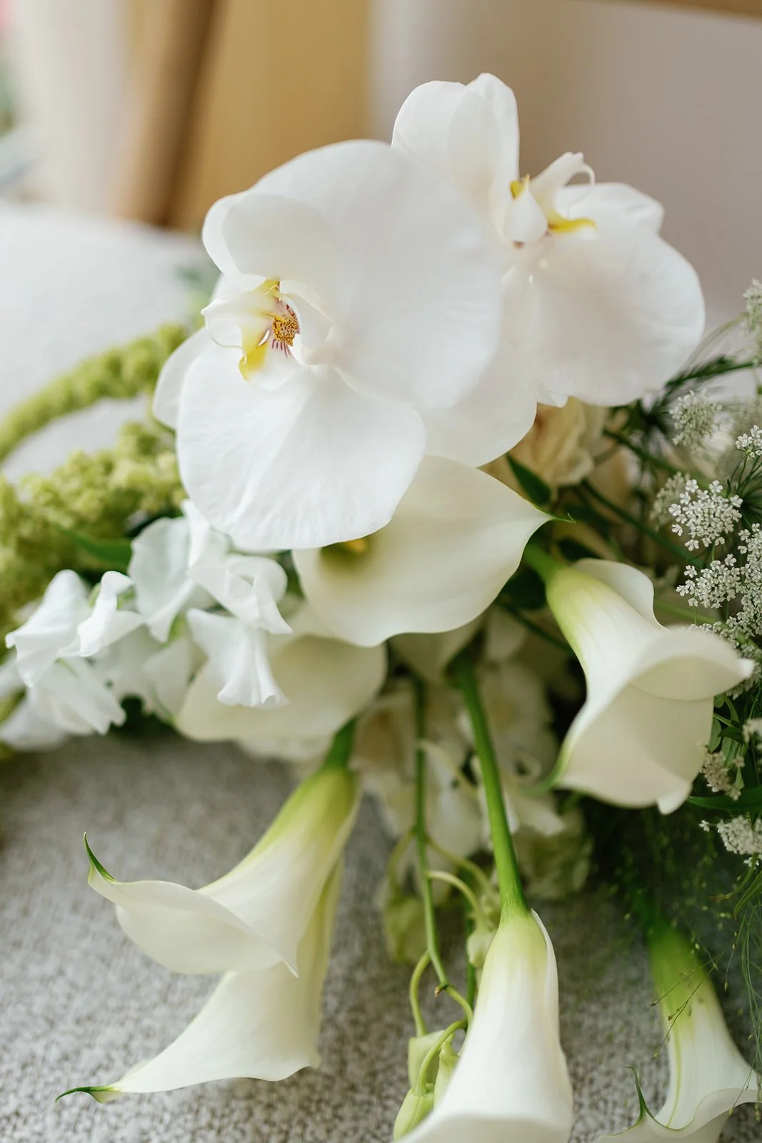 white modern bouquet with amaranthus calla lilies and orchids