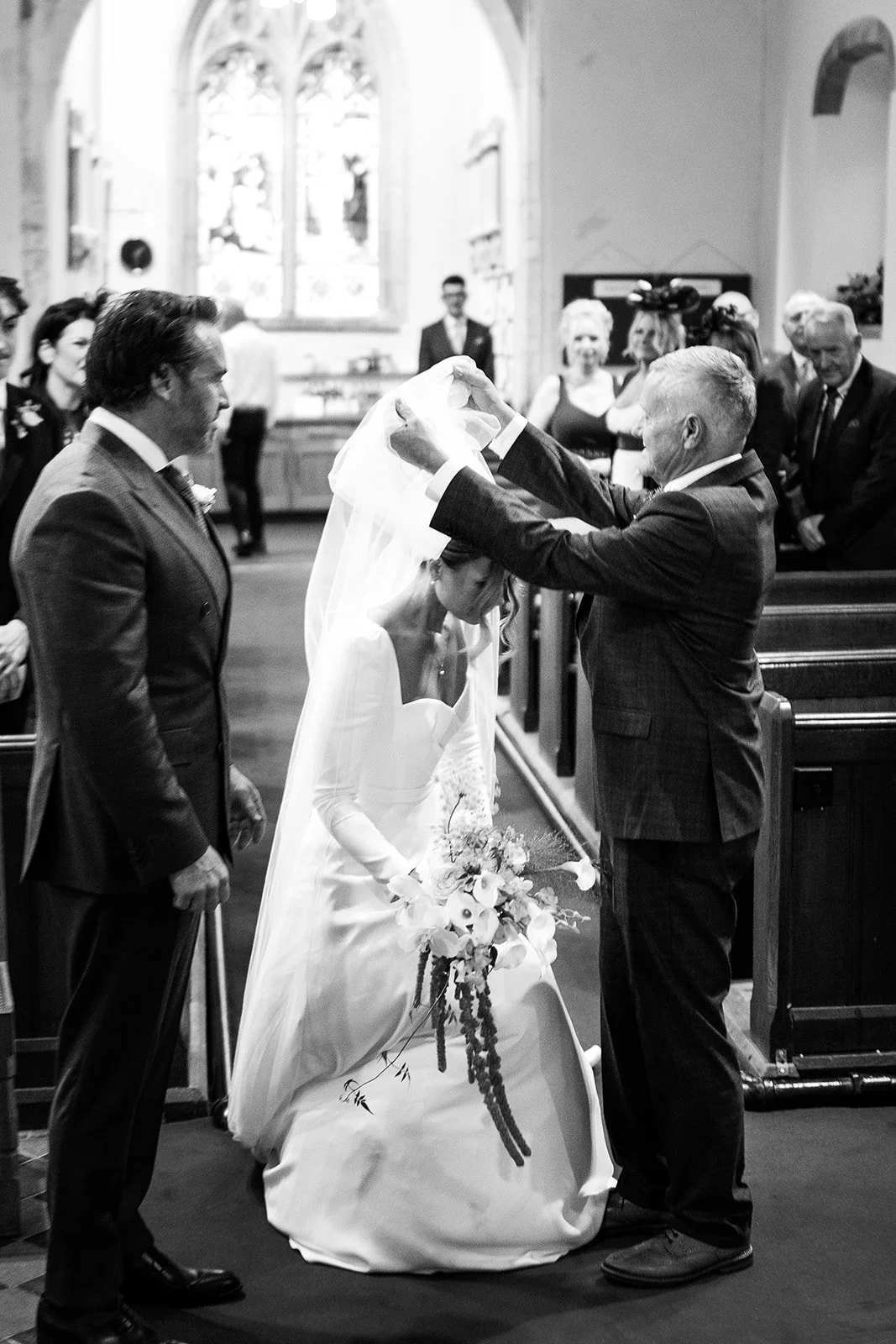 bride and groom at the alter
