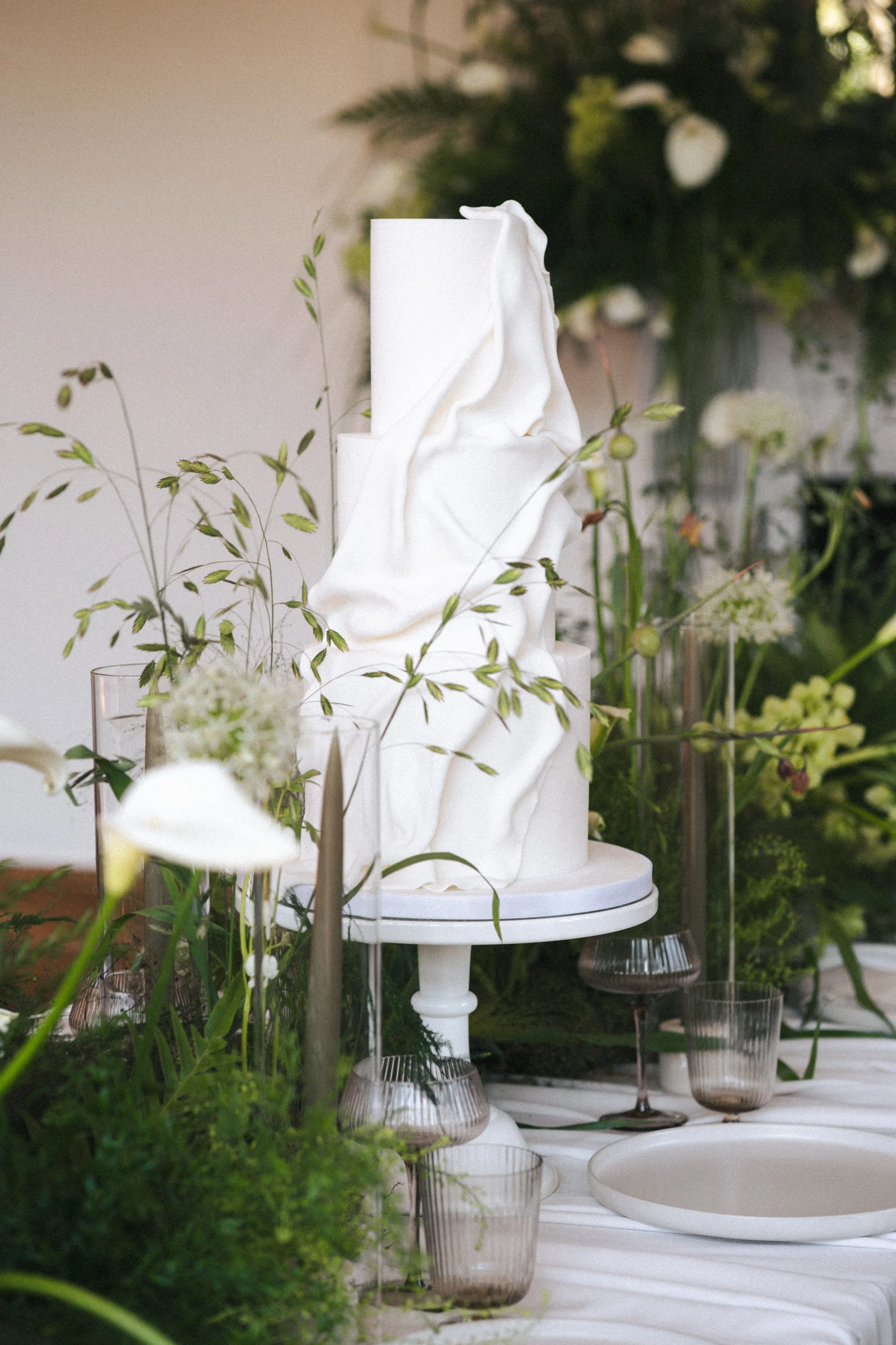 Textural wedding cake with textural grasses for wedding reception at Thicket Priory