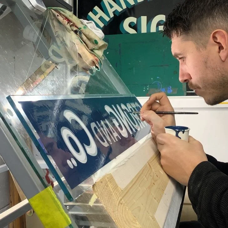 Backlighting this glass sign while second coating it is really helpful. If light gets through, gold will too&hellip; so better to fix it now!