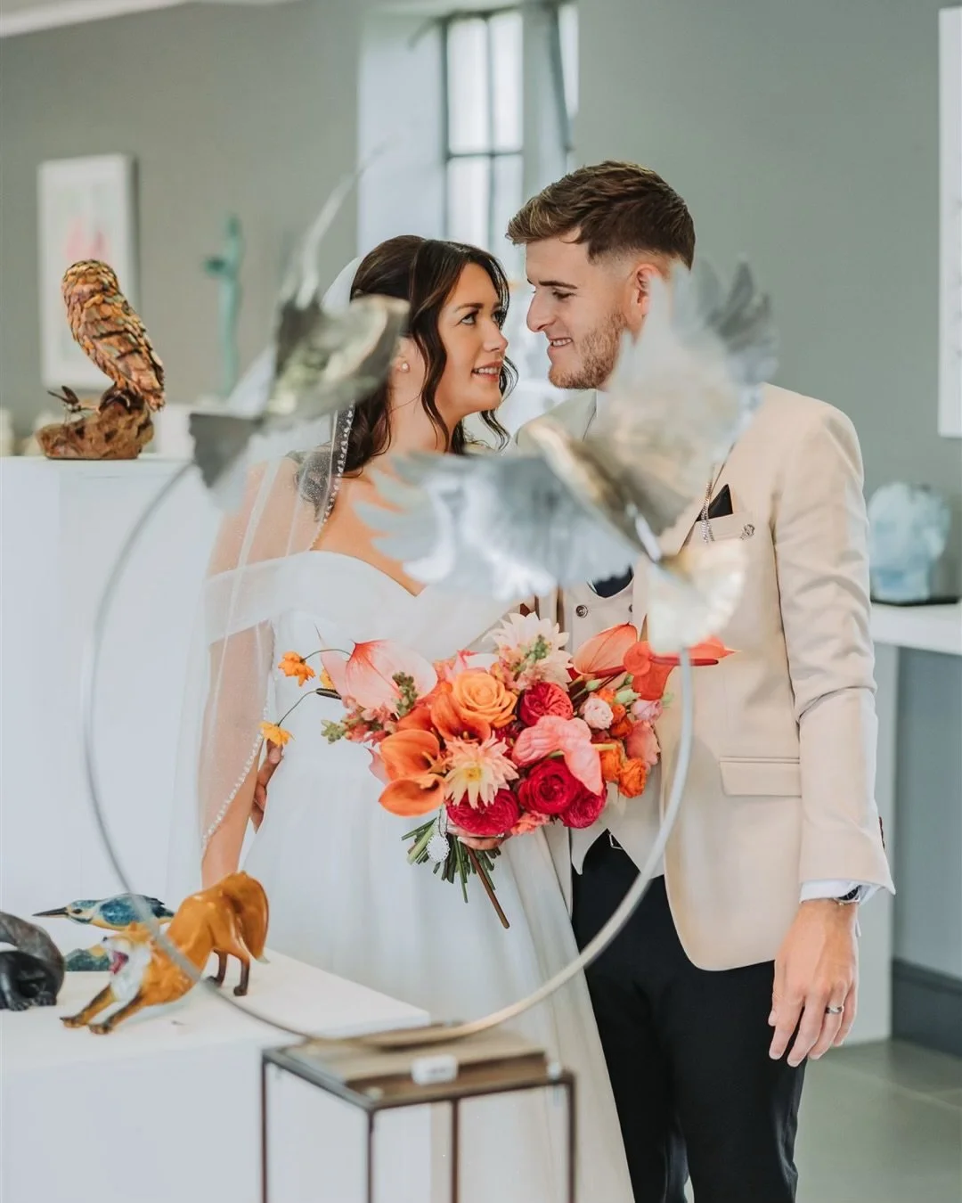 Bride & Groom posing for wedding photo ar Doddington Hall in Lincoln. 