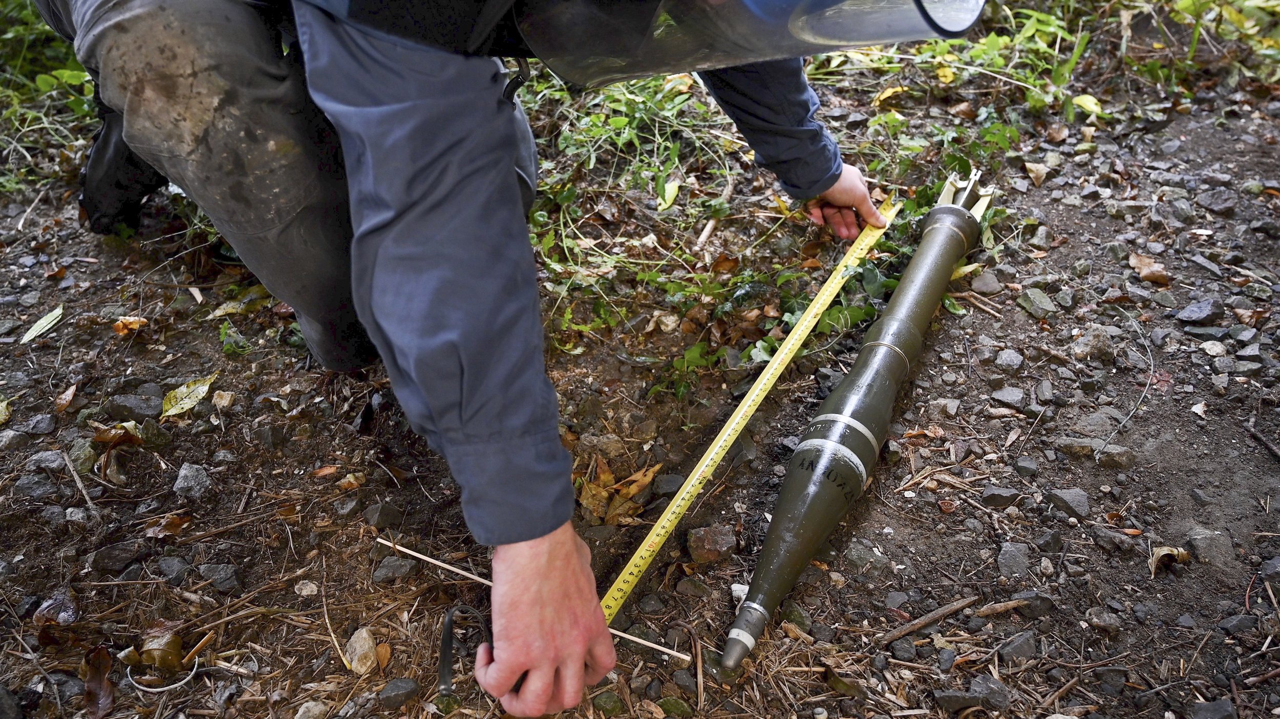  A specialist is setting up survey equipment, preparing for a technical survey as part of Artios Global’s comprehensive training in mine action methodologies. 