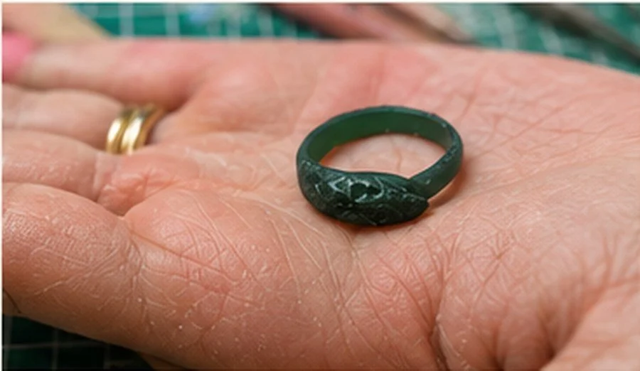 Finished green wax ring model ready to be cast into silver.