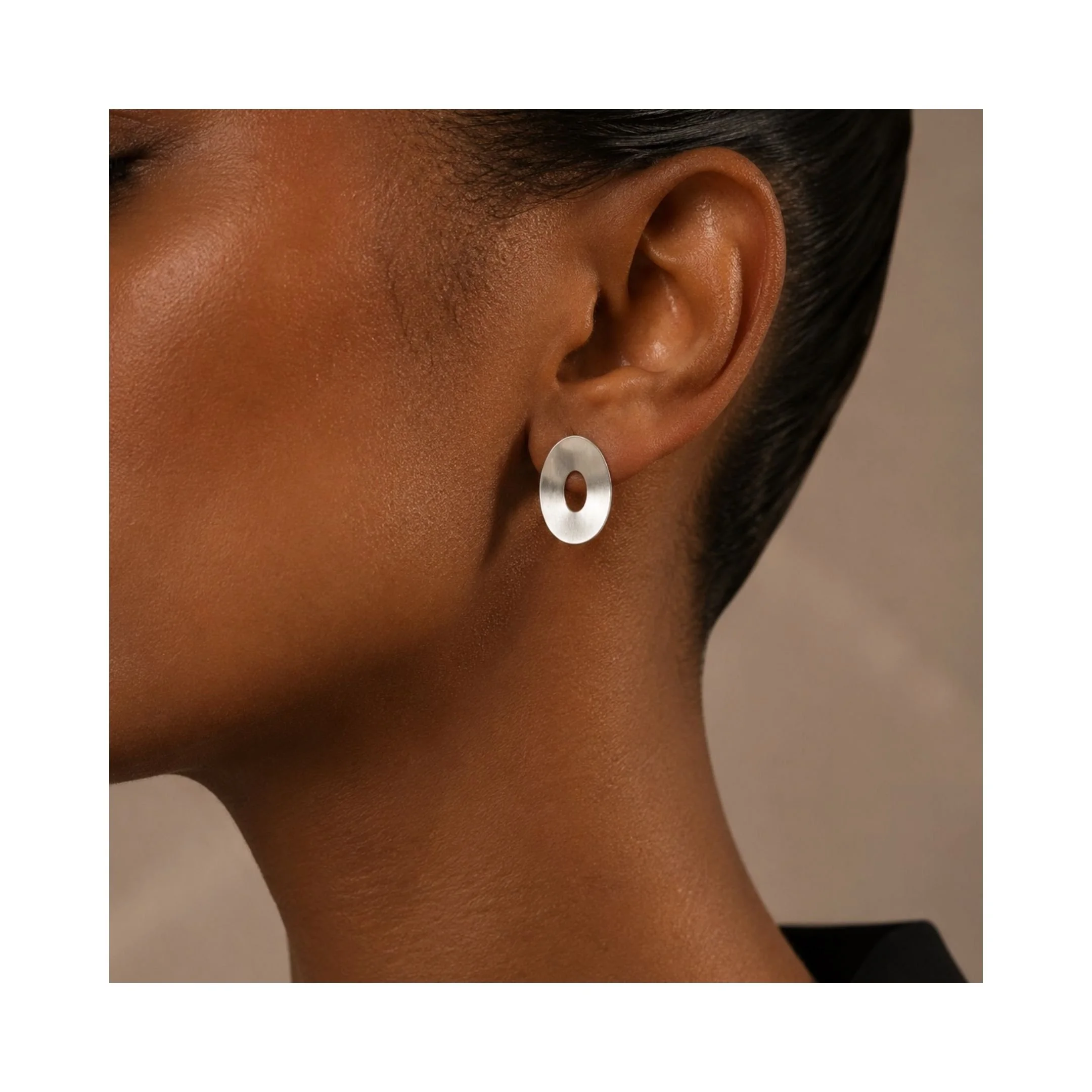 Floating-Ovals-Full-Bloom-sterling-silver-stud-earrings-on-ear.jpg
