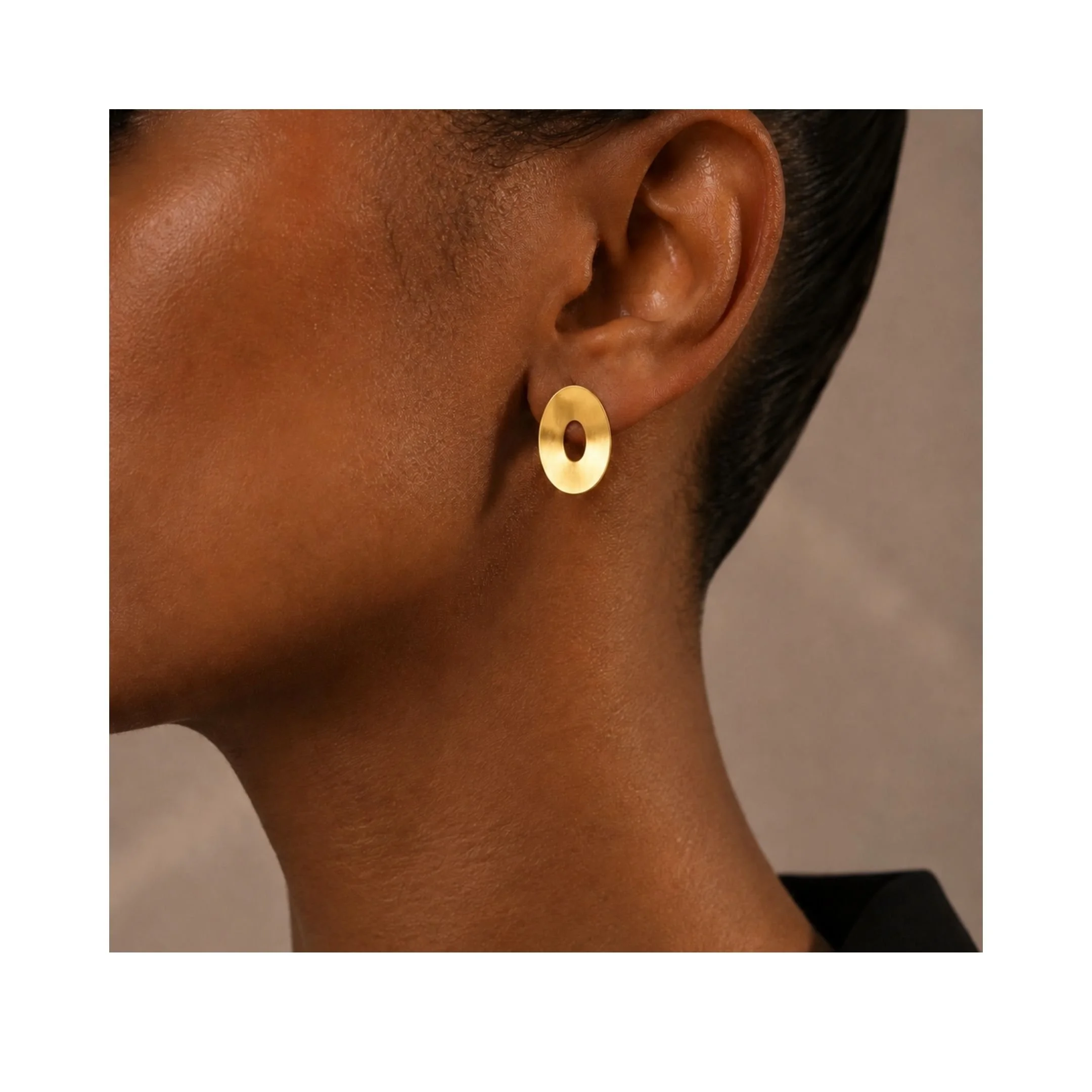 Floating-Ovals-Full-Bloom-gold-vermeil-stud-earrings-on-ear.jpg
